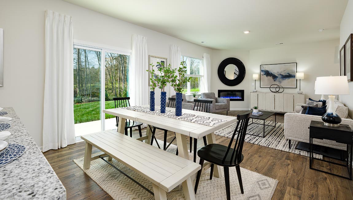 Dining area by kitchen, beside sliding glass doors outside