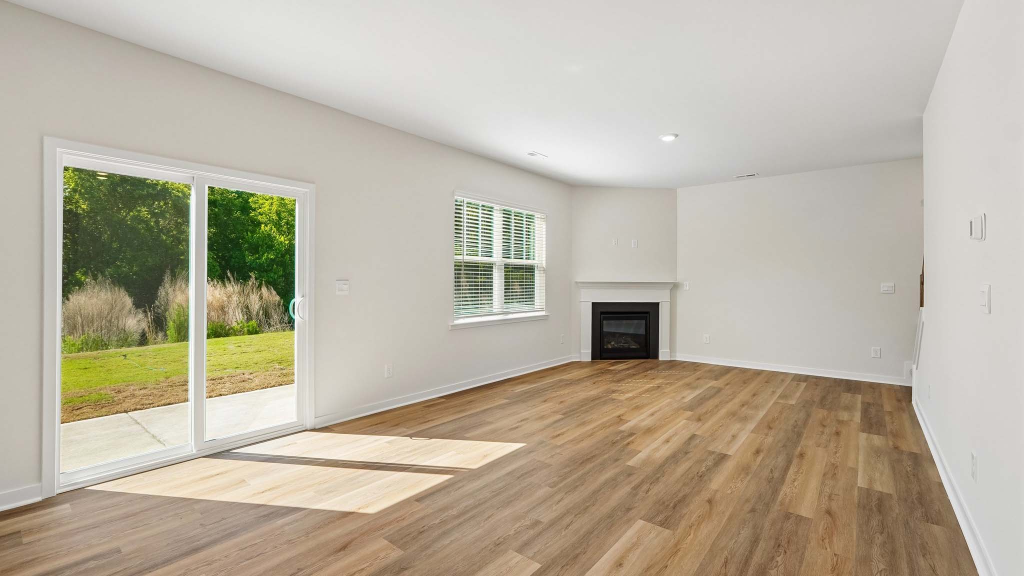 Living room with large windows and fireplace