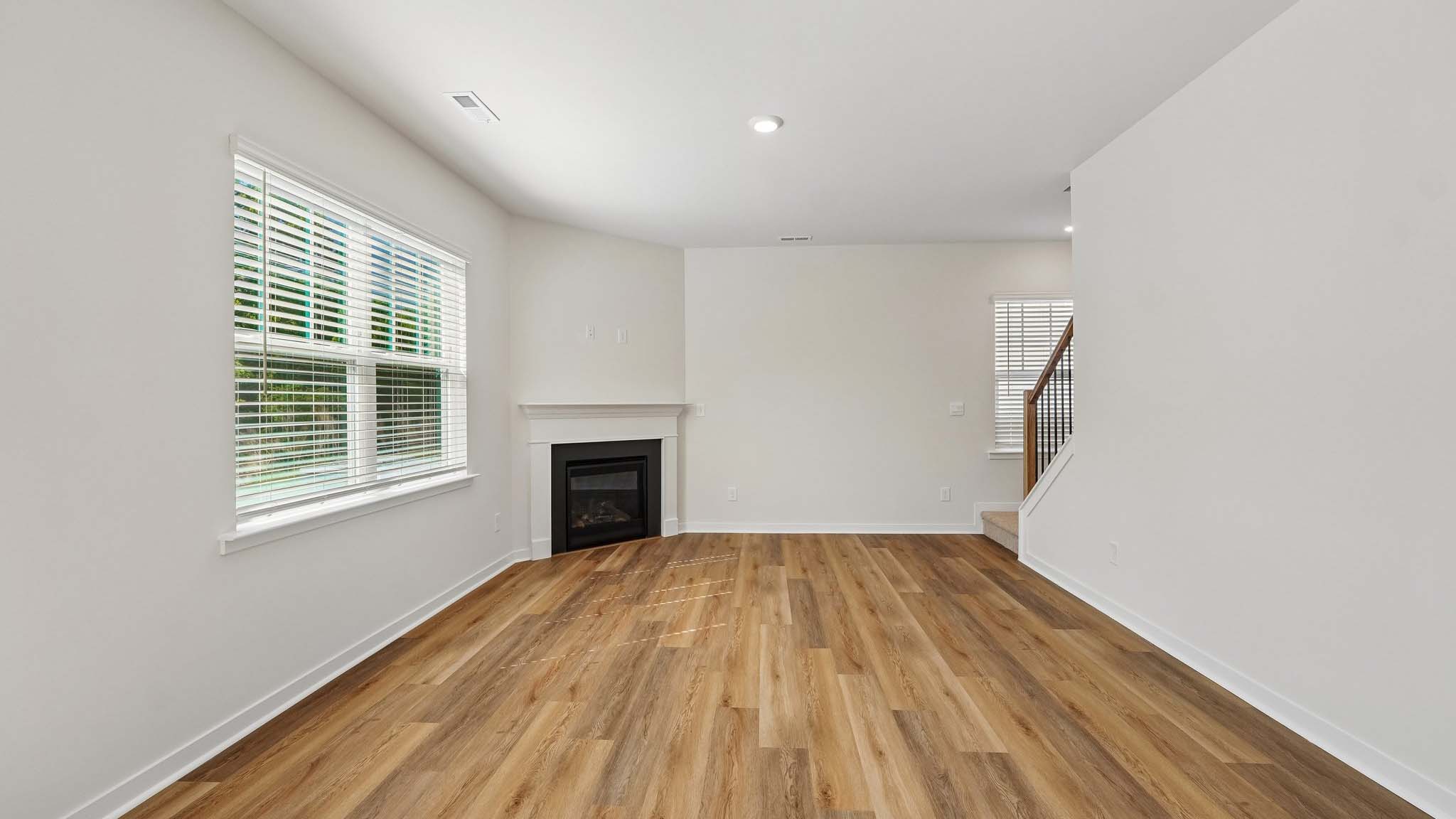 Living room with large windows and fireplace