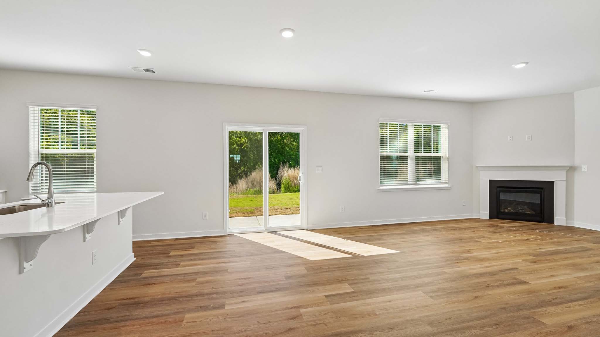 Living room with large windows and fireplace