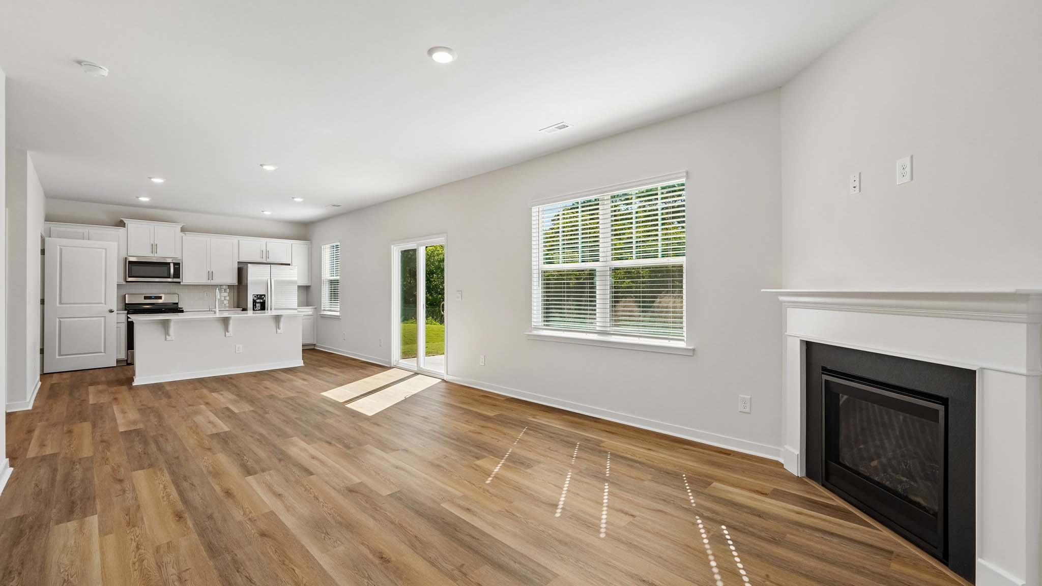 Living room with large windows and fireplace