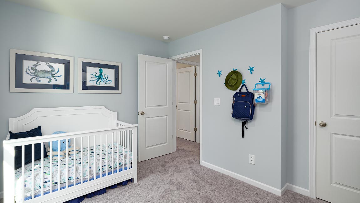 Carpeted bedroom with large windows