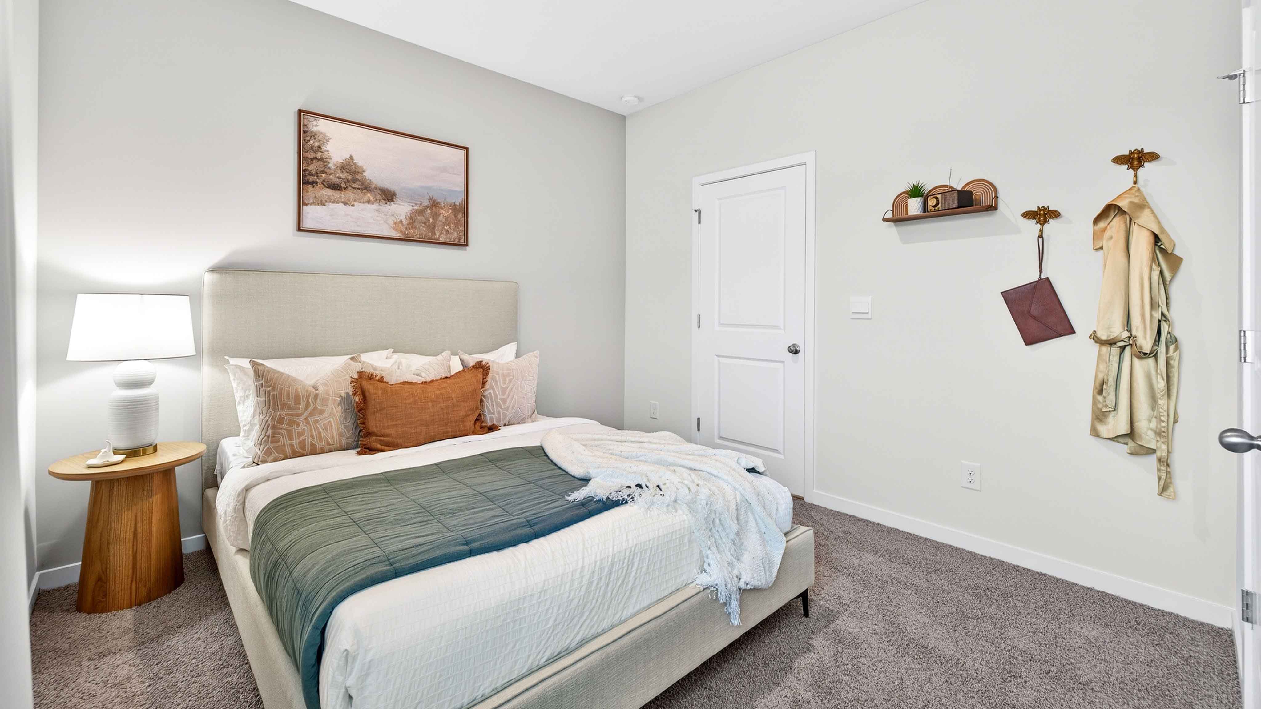 Carpeted bedroom with large window