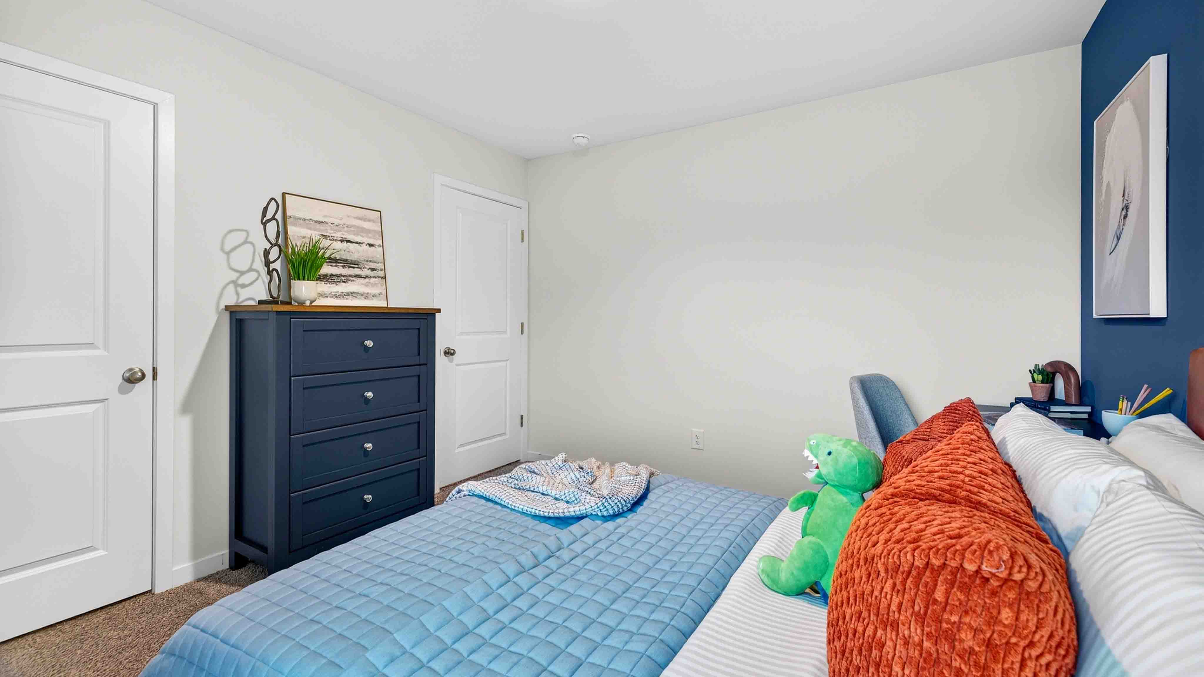 Carpeted bedroom with large window