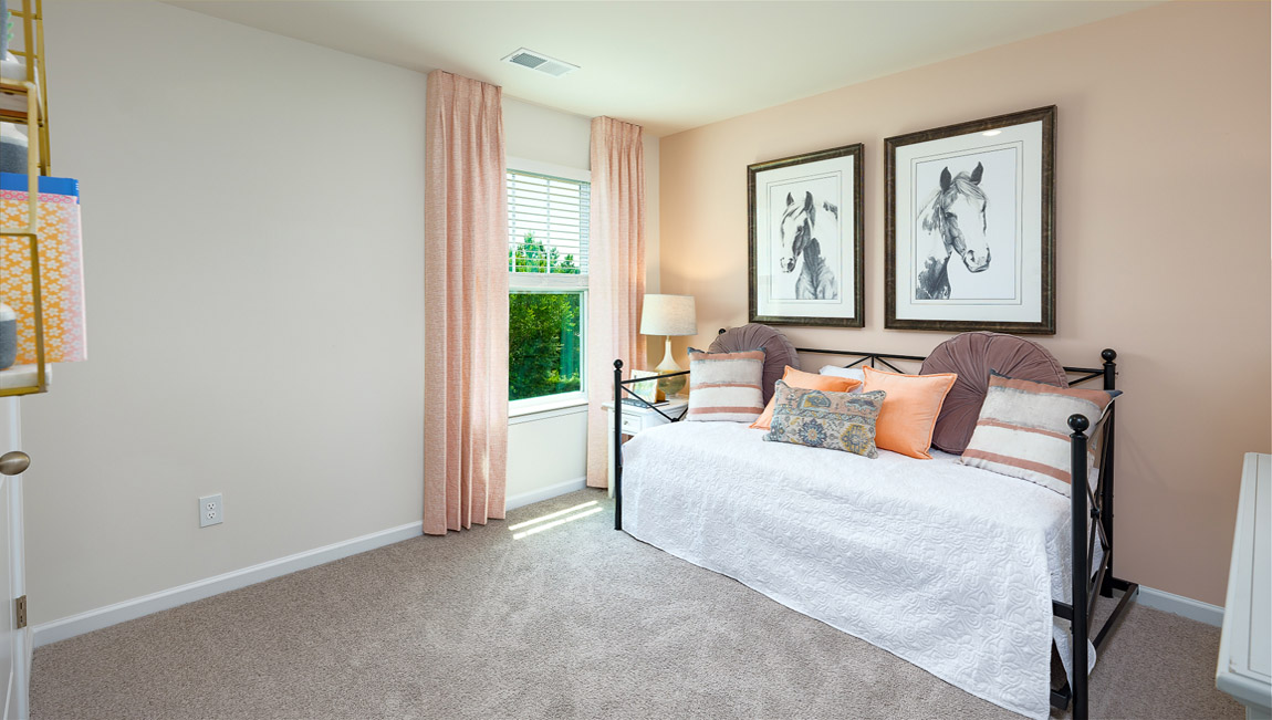 Carpeted bedroom with large window