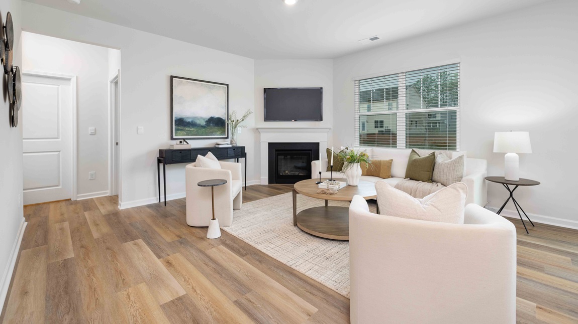 Open living room with large window, and fireplace