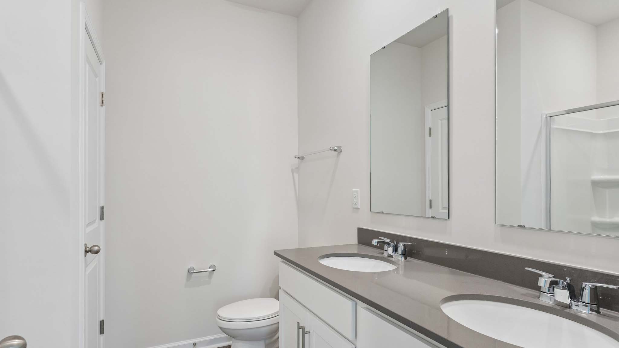 Primary bathroom with double sinks, and bathtub