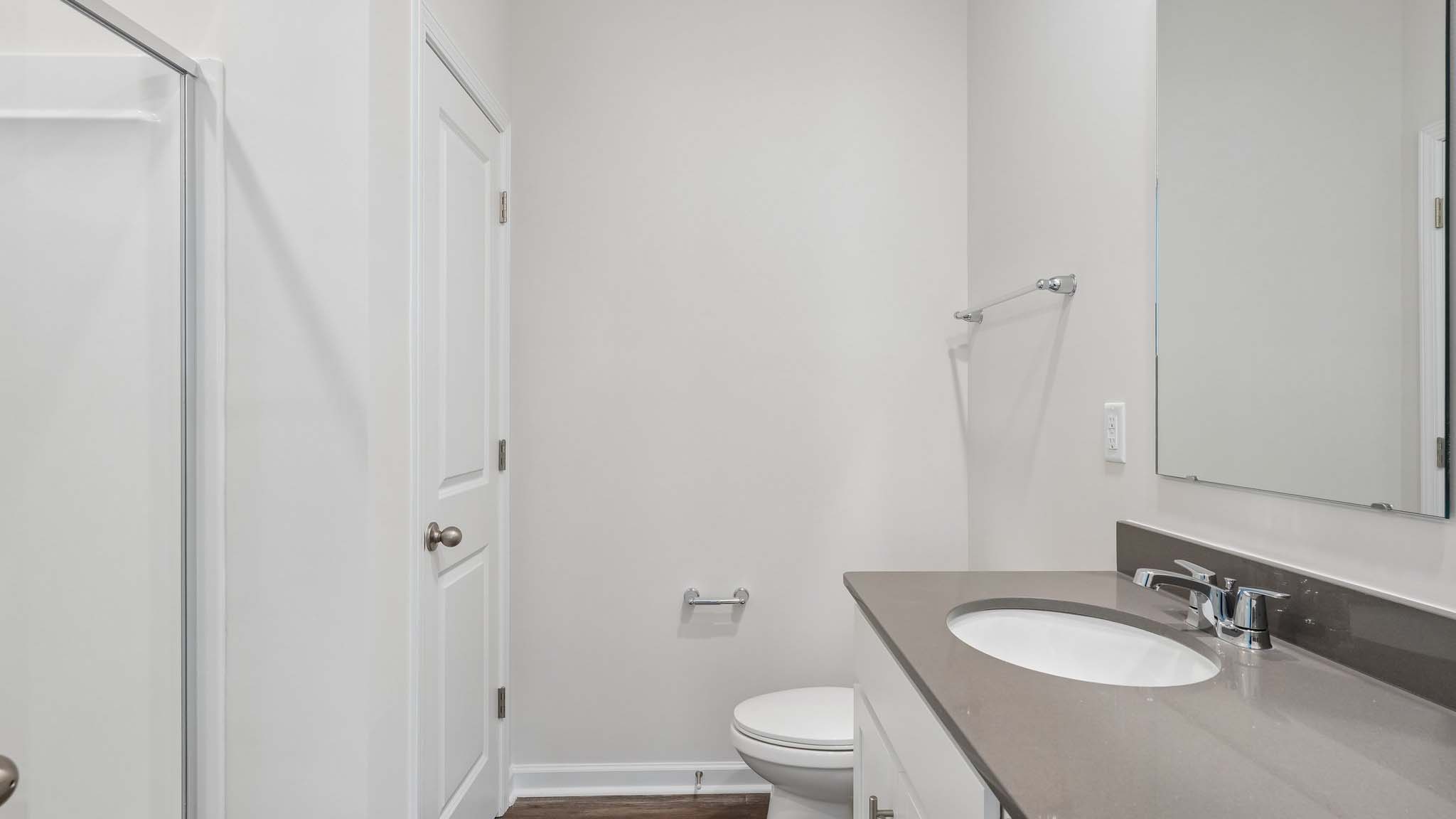Primary bathroom with double sinks, and bathtub