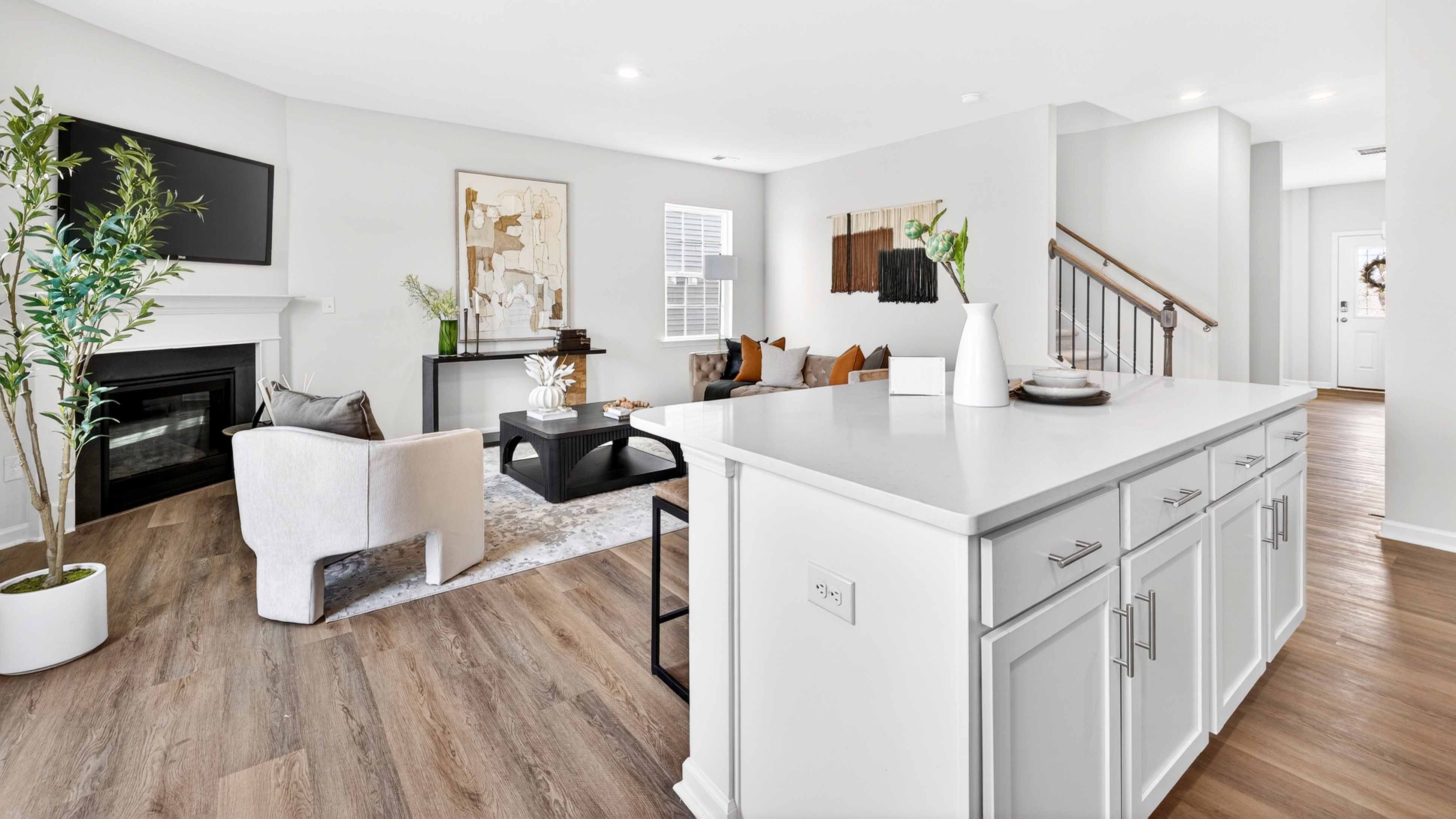 Kitchen and island with white counters and cabinets