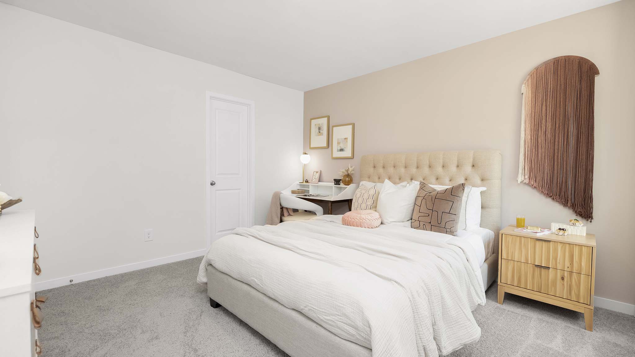 Carpeted bedroom with large window