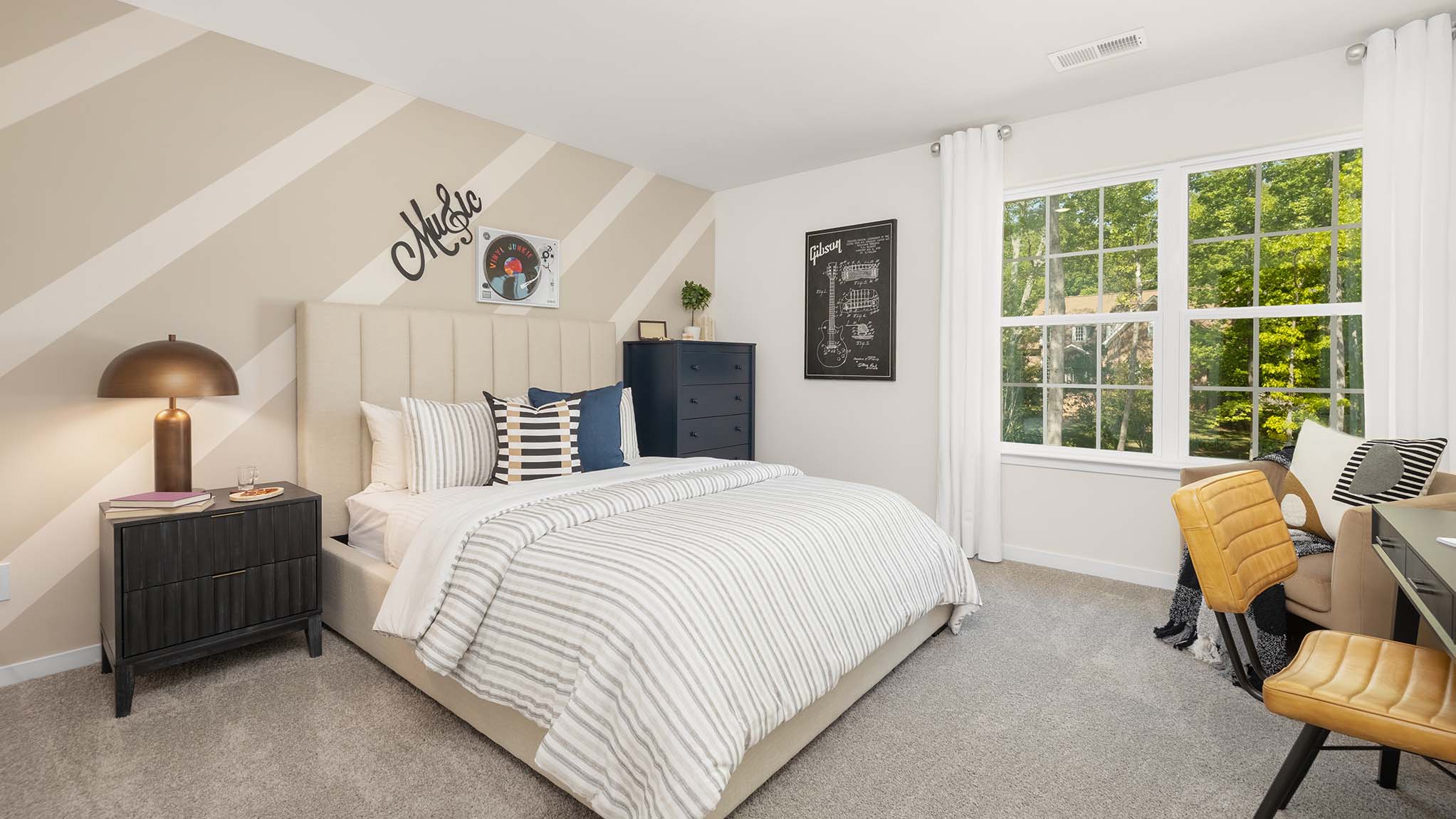 Carpeted bedroom with large window