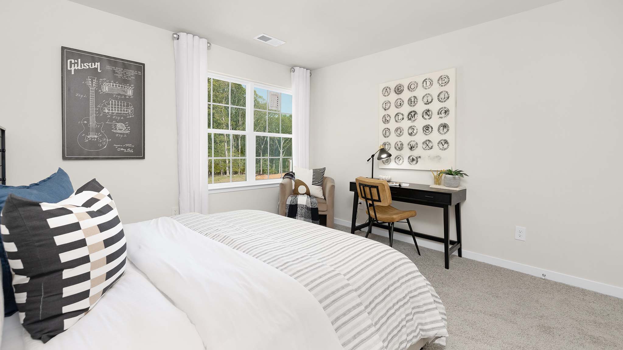 Carpeted bedroom with large window