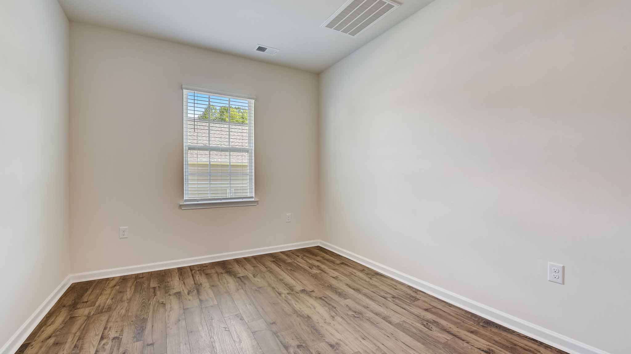 Open family room with windows and fireplace