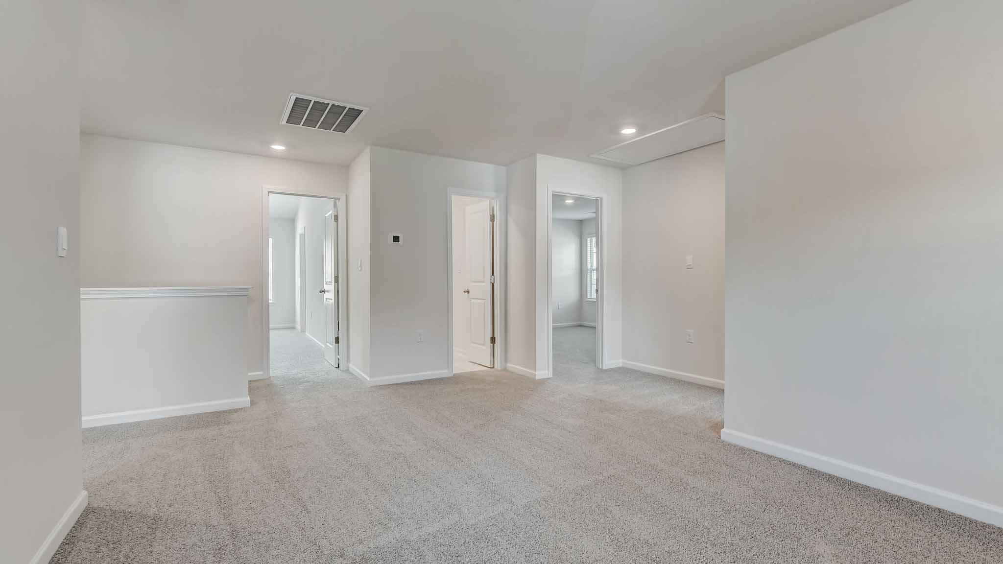 Carpeted bedroom with large window