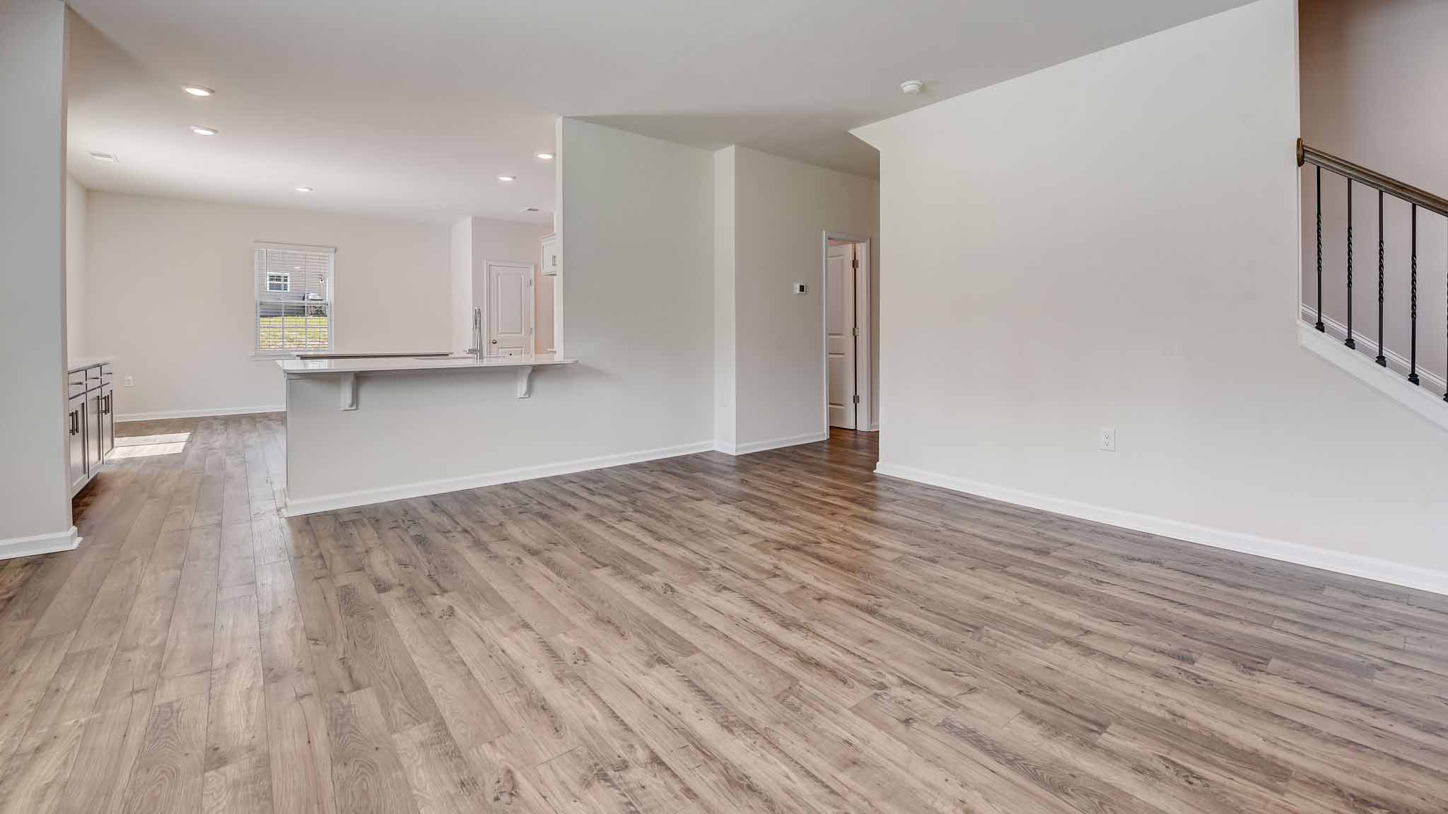 Open family room with windows and fireplace