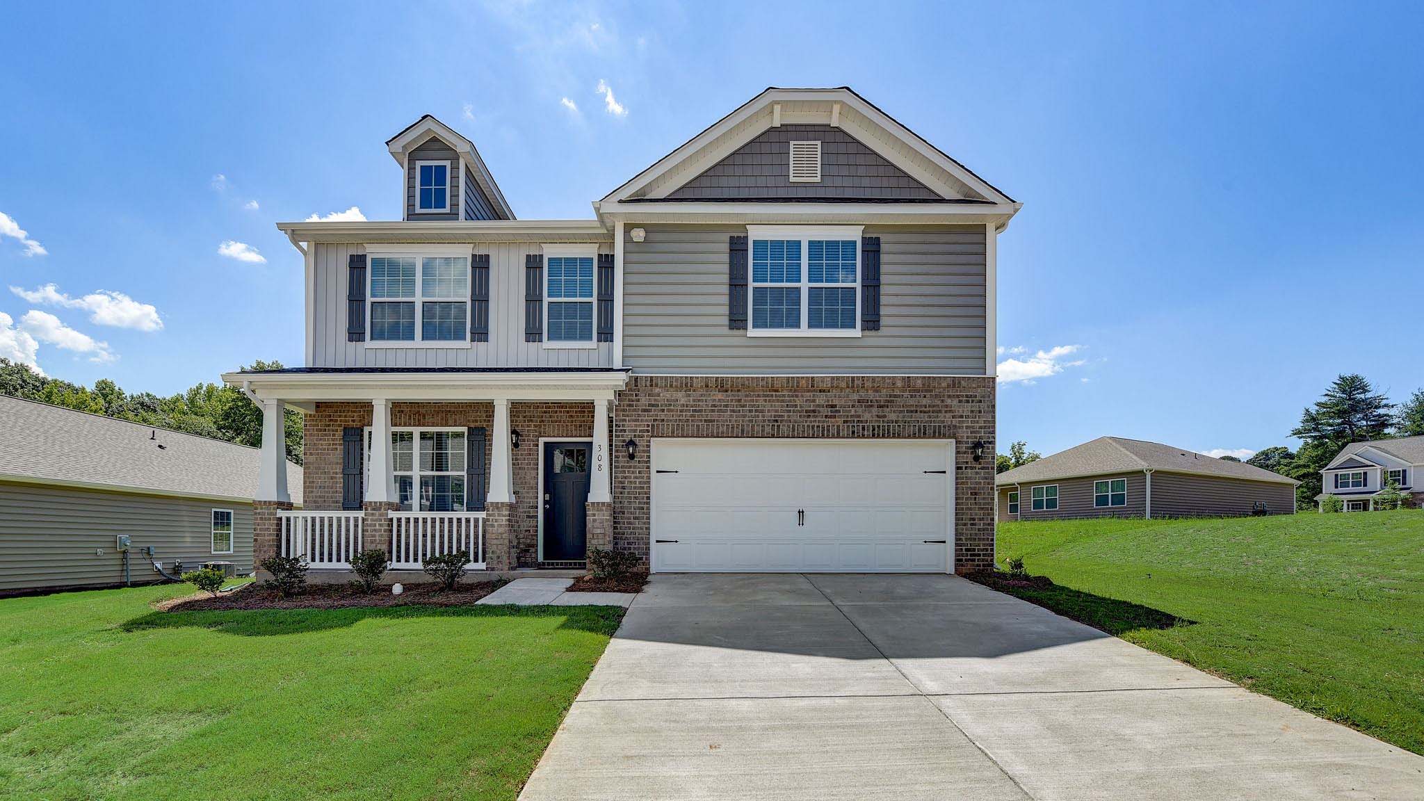 Wilmington Exterior with brick and siding and two car garage