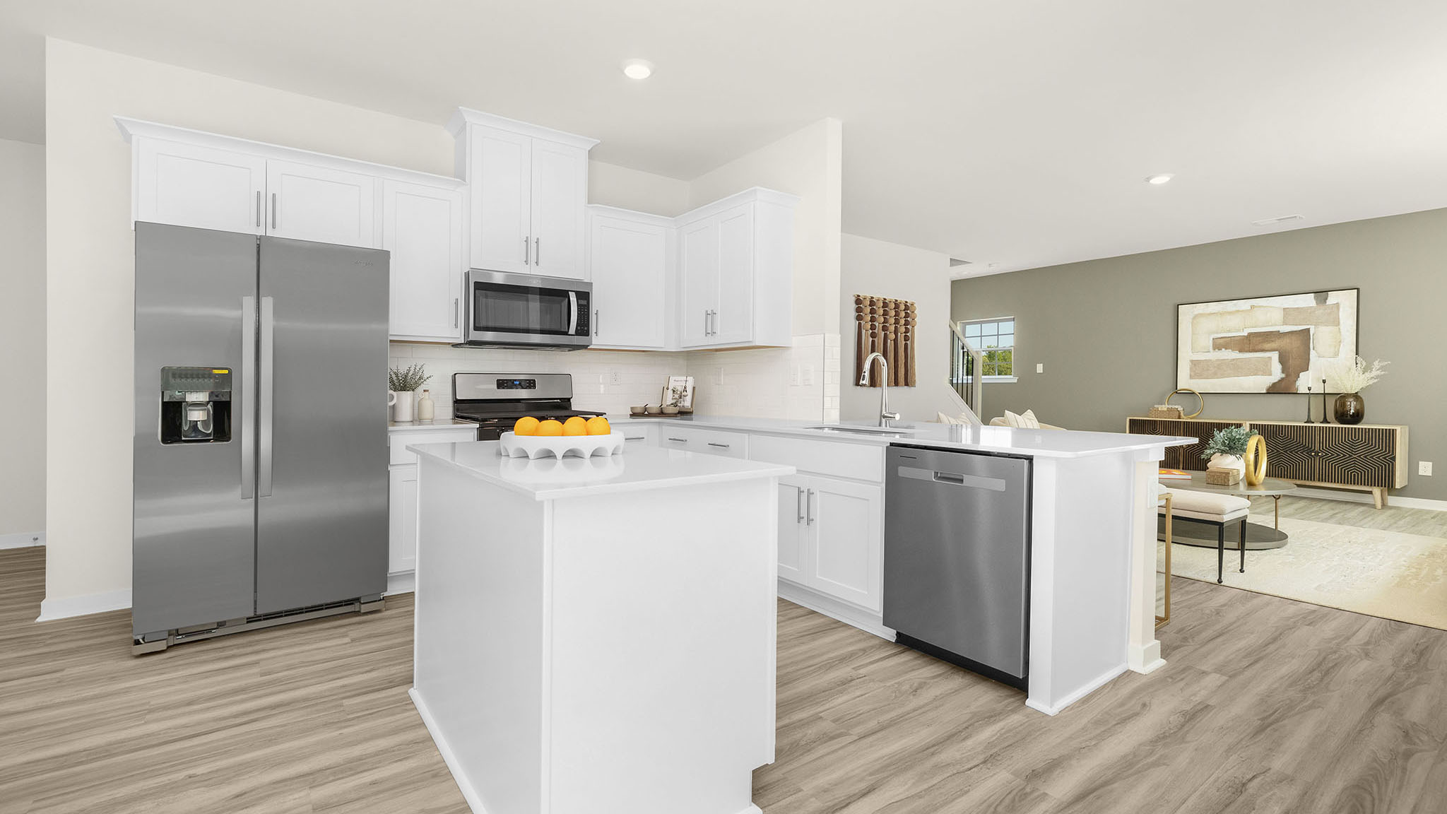 Kitchen and island with white cabinets