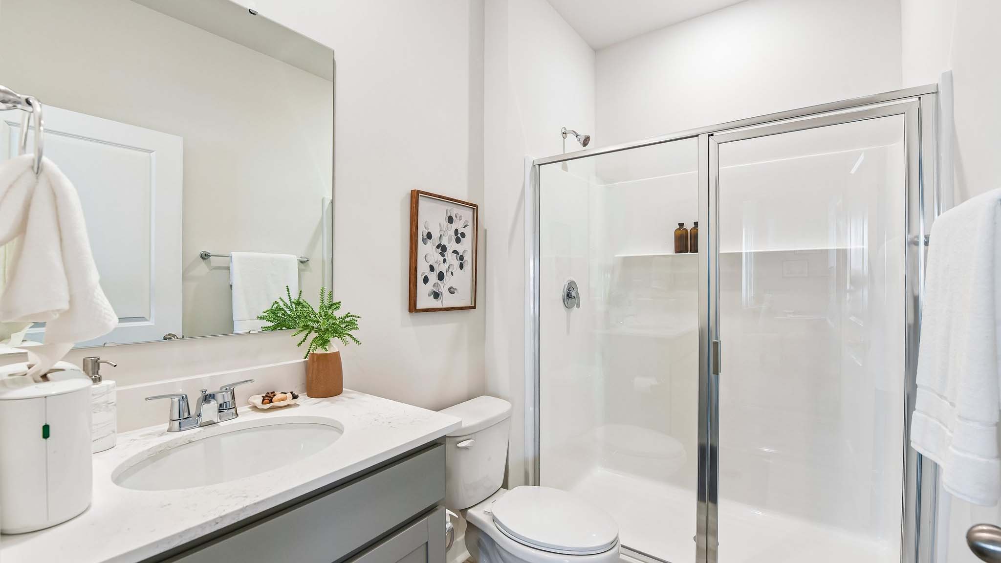 Bathroom with standing glass shower
