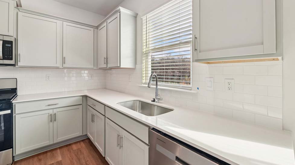 Kitchen and island with stainless steel appliances