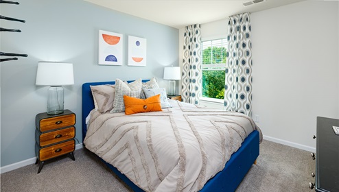 carpeted bedroom with large window