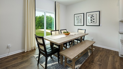 Dining room area beside kitchen with sliding glass back door