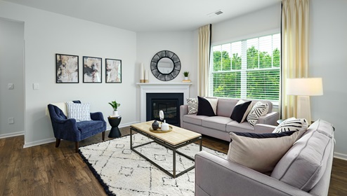 Open living room with large window, and fireplace