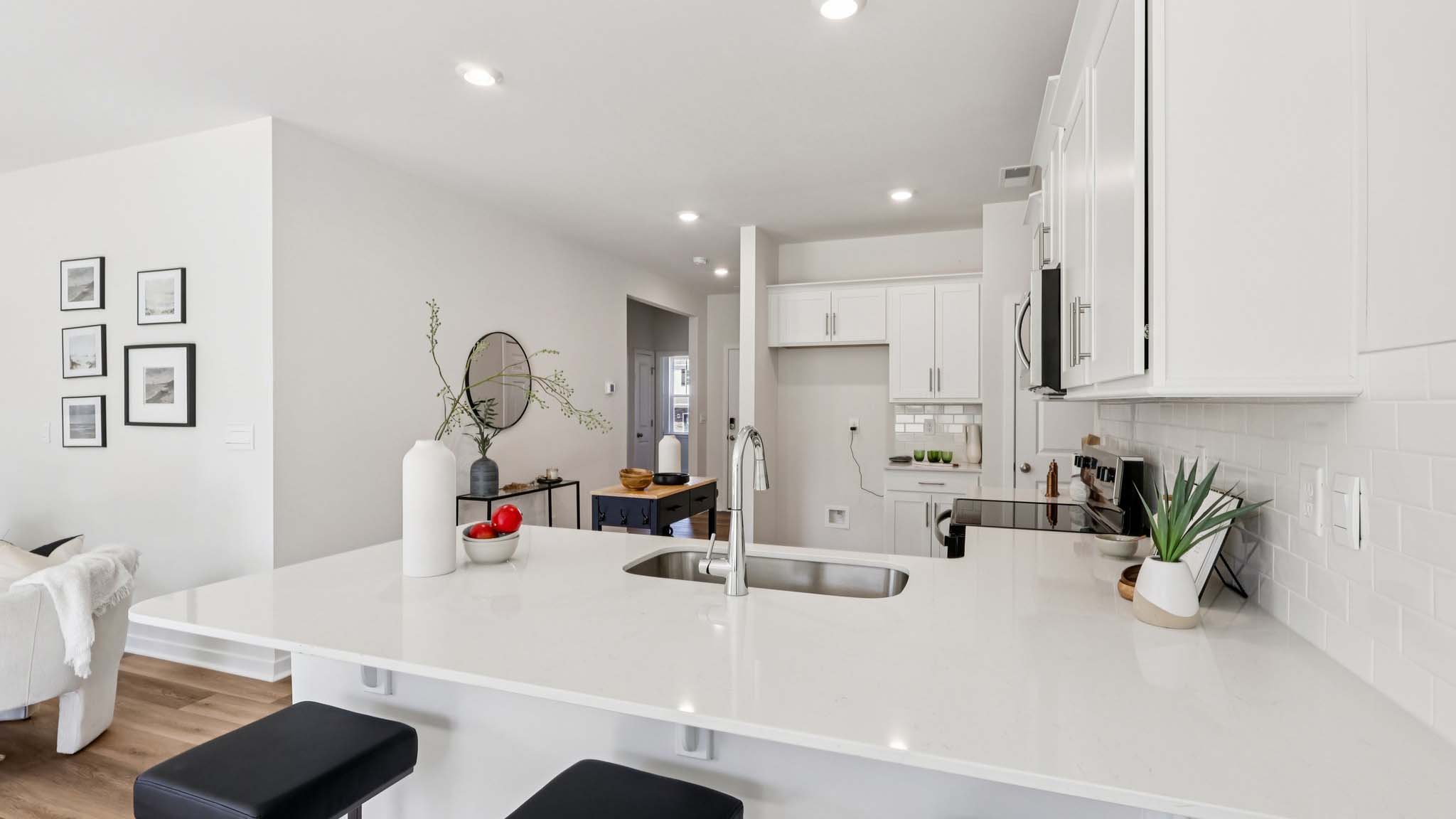 Kitchen with white cabinets and stainless steel appliances