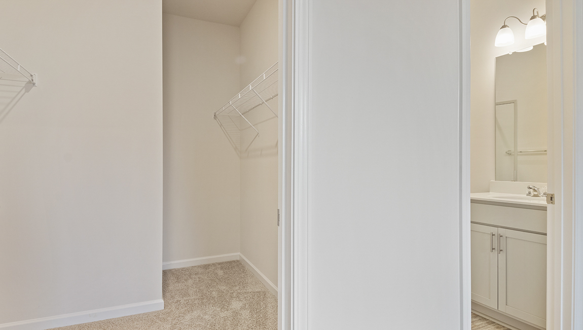 Primary bedroom walk in closet