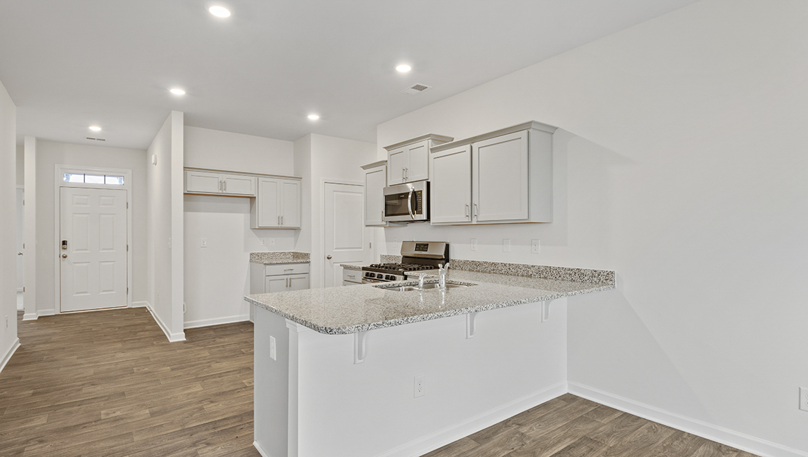 Kitchen with white cabinets and stainless steel appliances