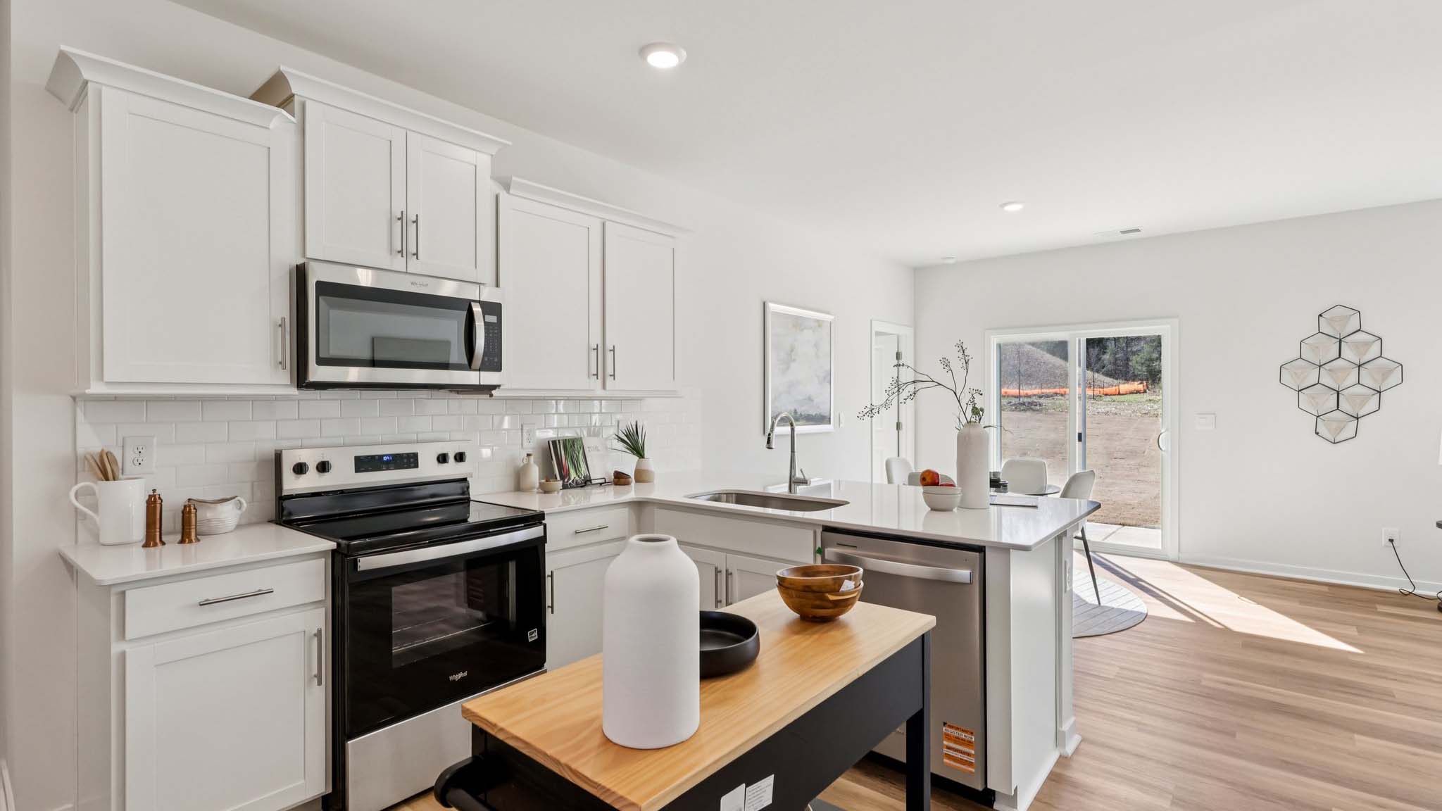 Kitchen with white cabinets and stainless steel appliances