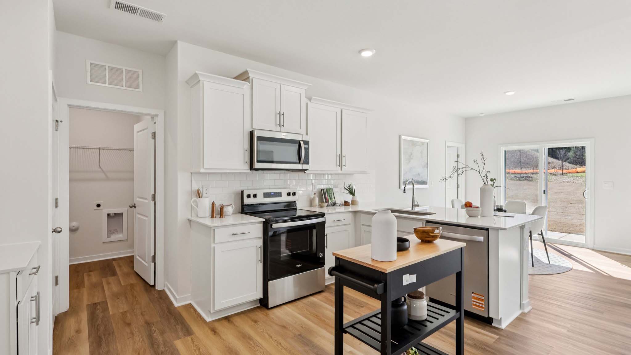 Kitchen with white cabinets and stainless steel appliances