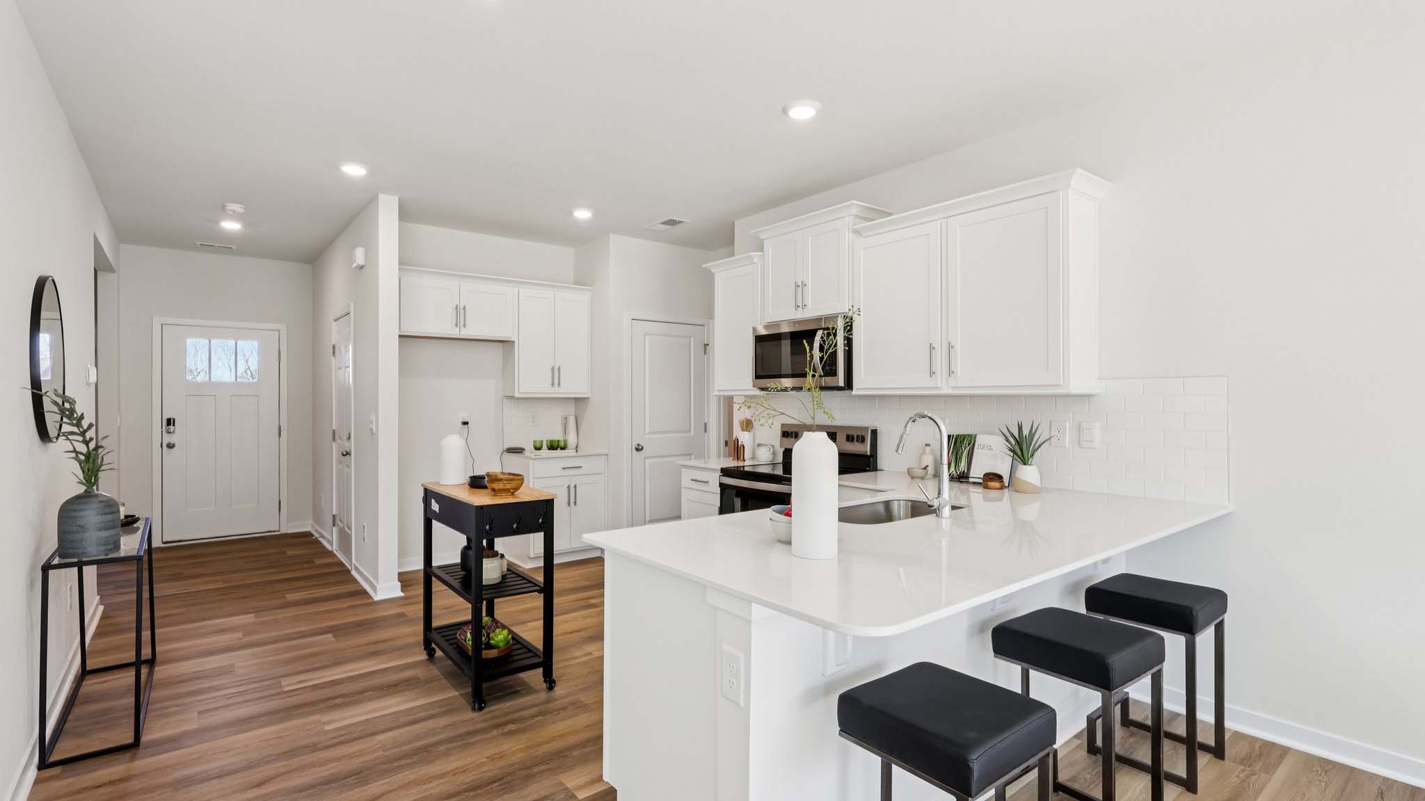 Kitchen with white cabinets and stainless steel appliances