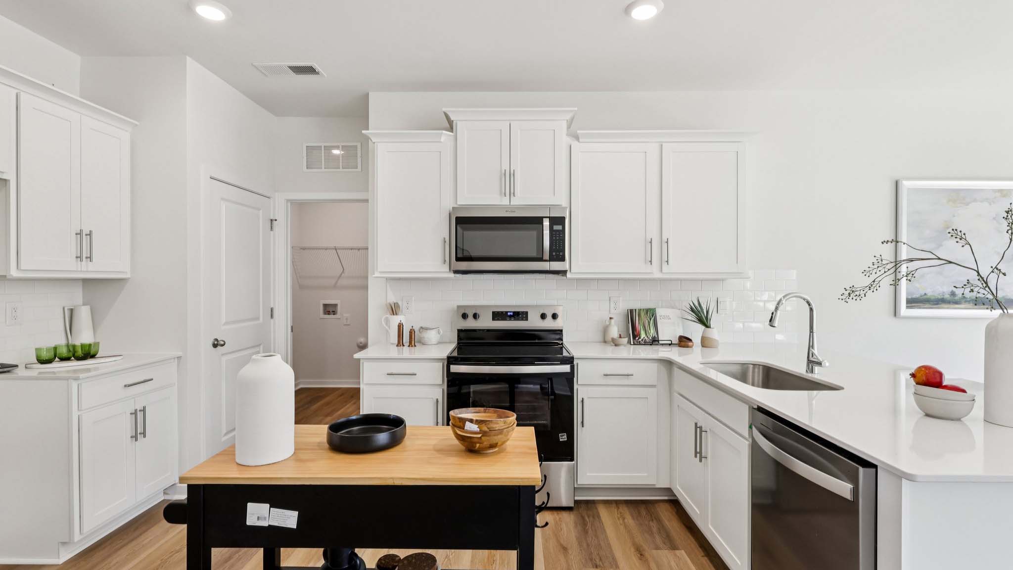 Kitchen with white cabinets and stainless steel appliances