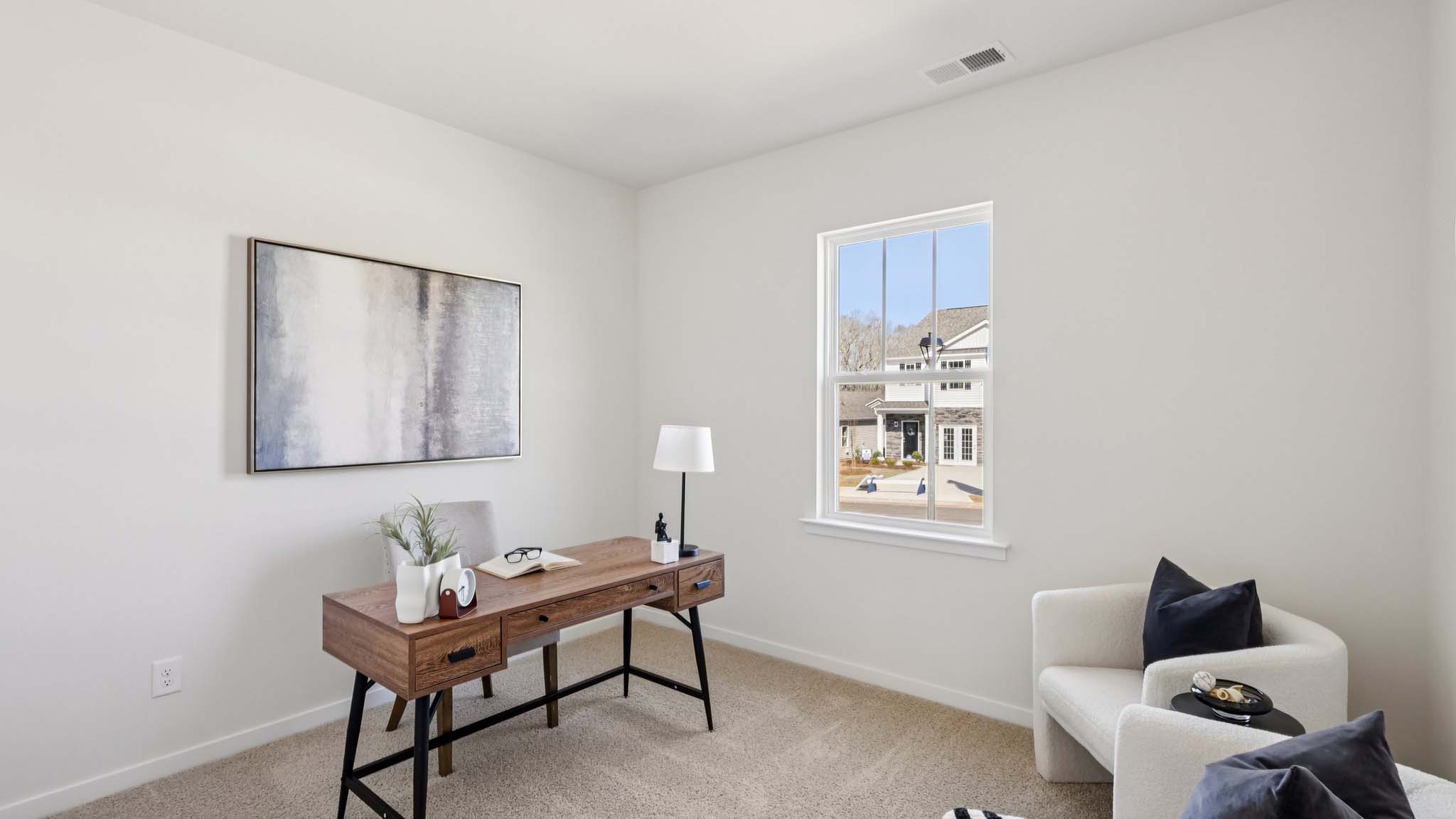 Carpeted bedroom with small window