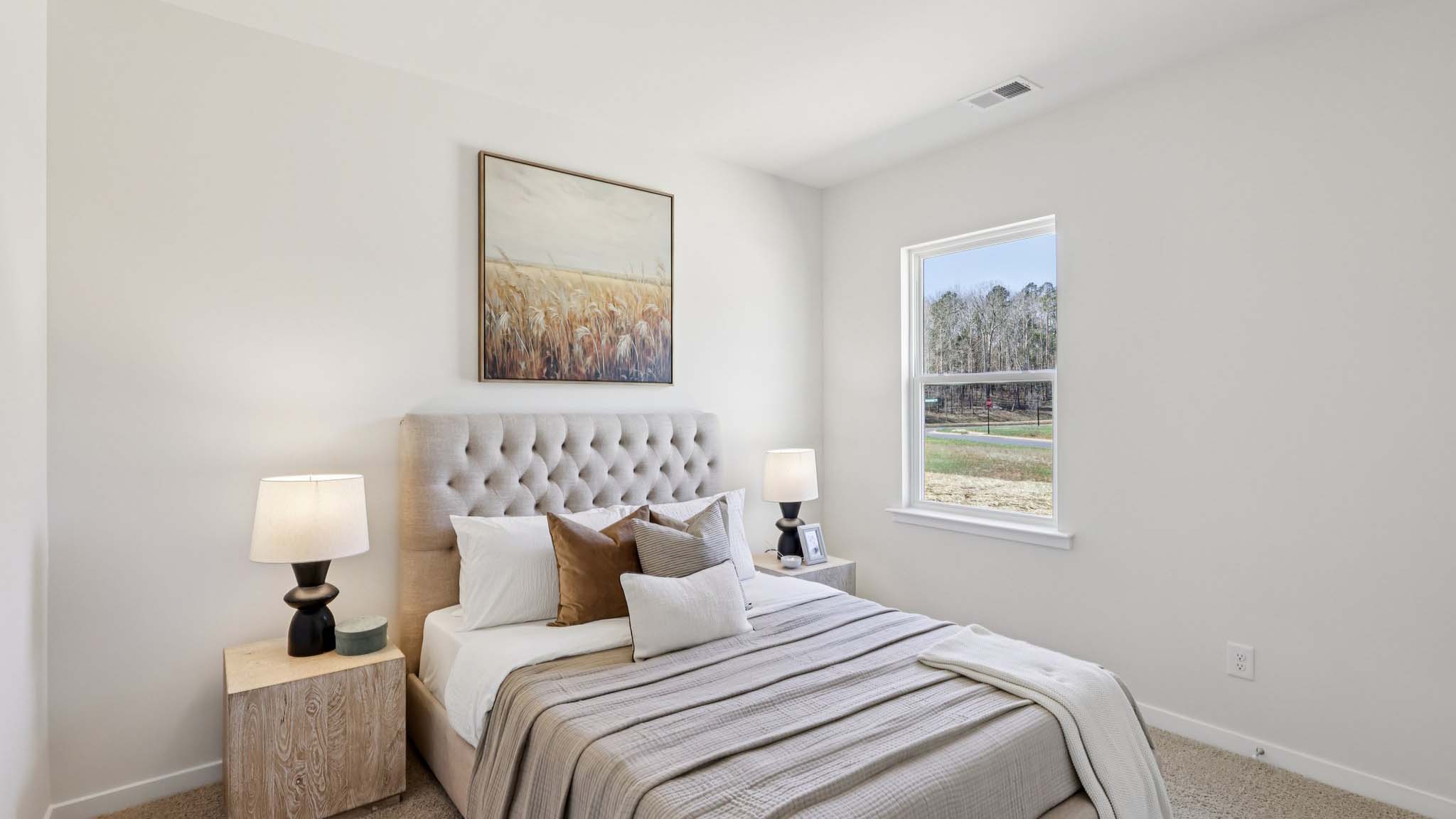 Carpeted bedroom with small window