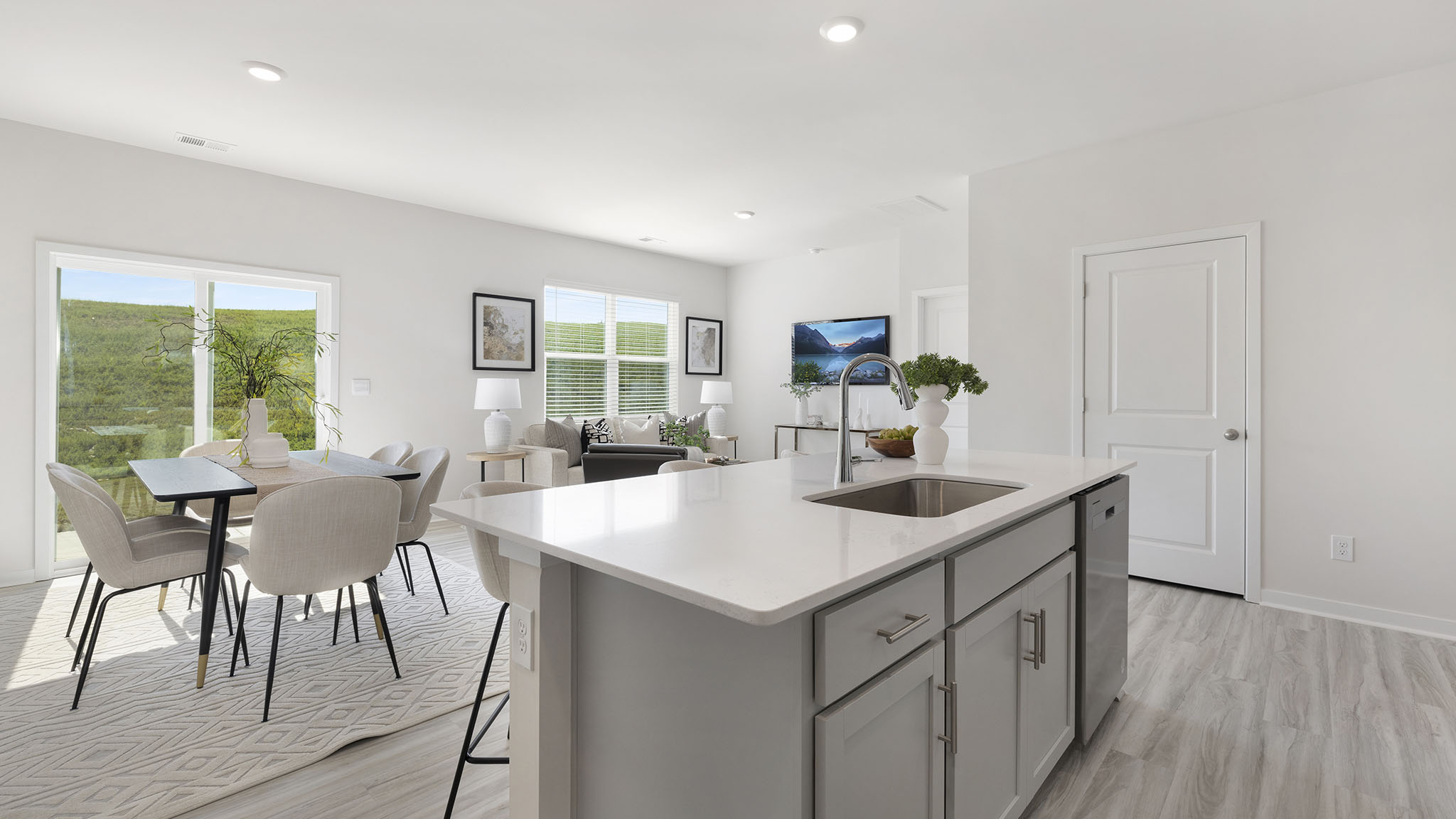 Open kitchen and island with white cabinets
