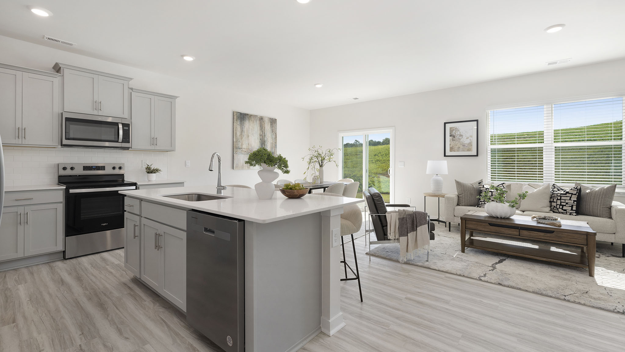 Open kitchen and island with white cabinets