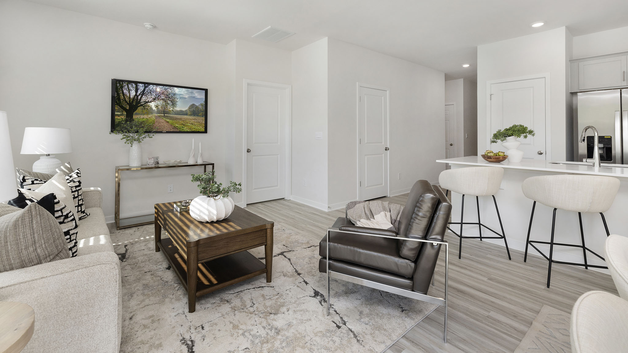 Great room with large window and wood floors