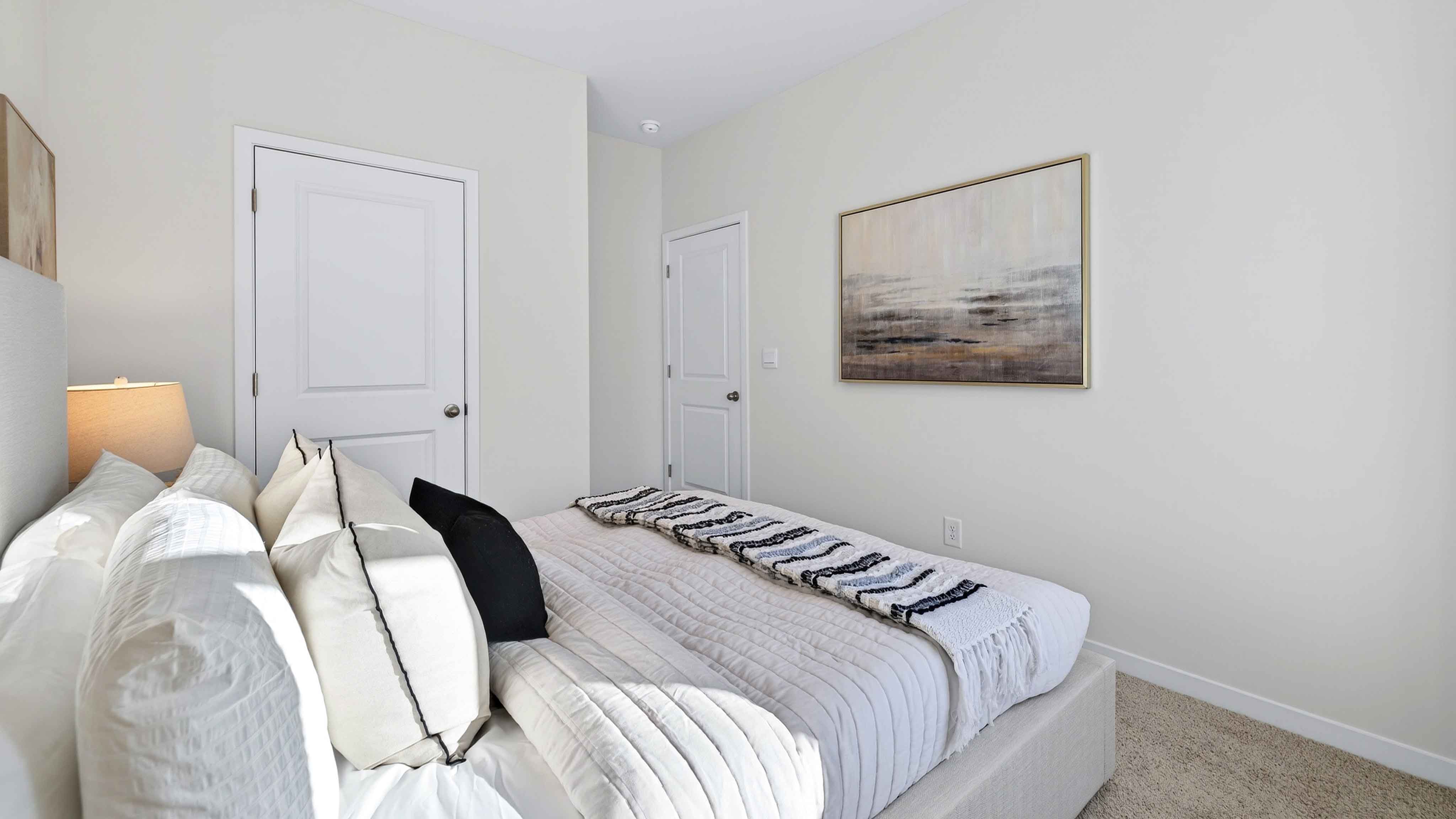 Carpeted bedroom with large window