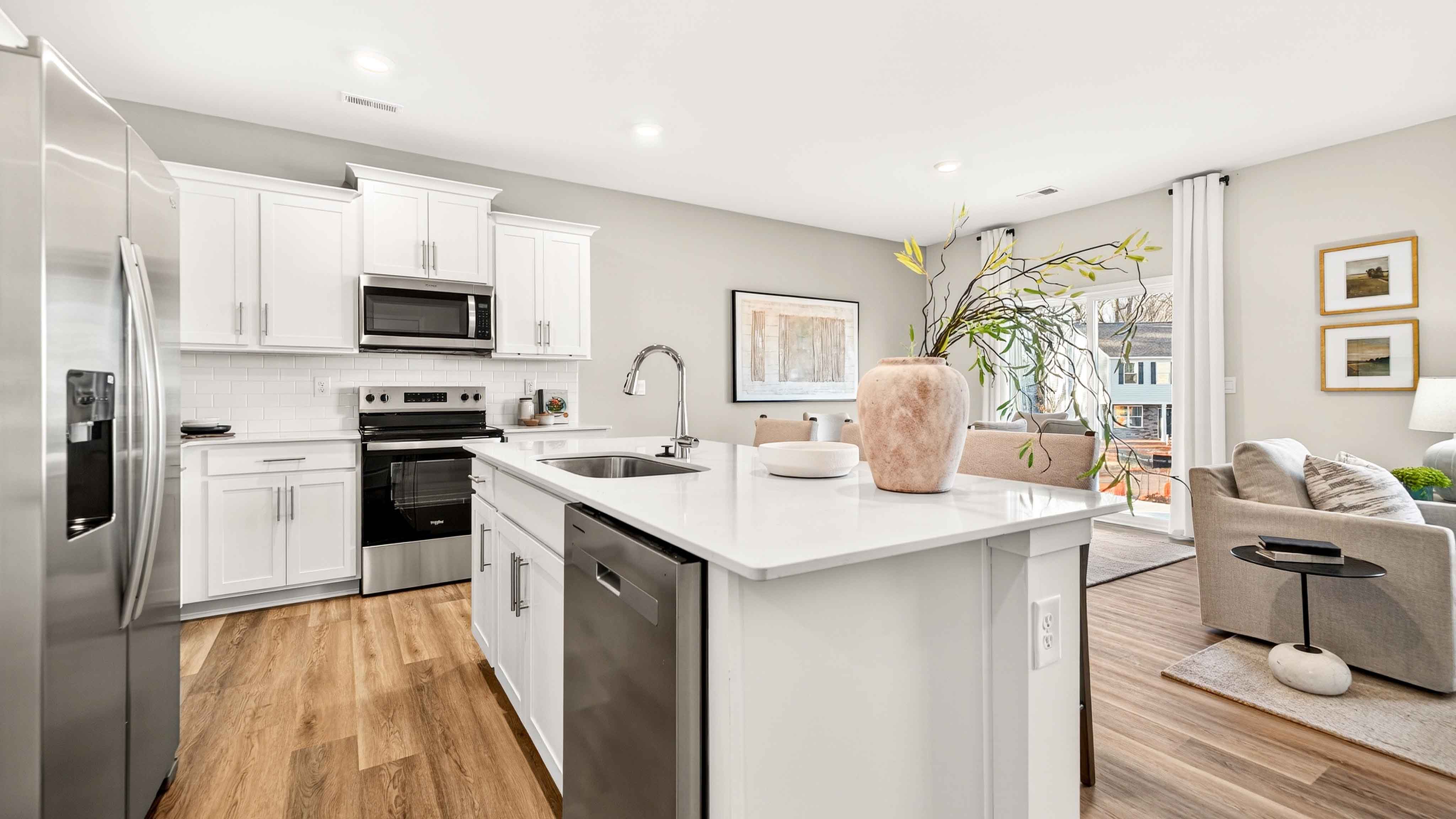 Open kitchen and island with white cabinets