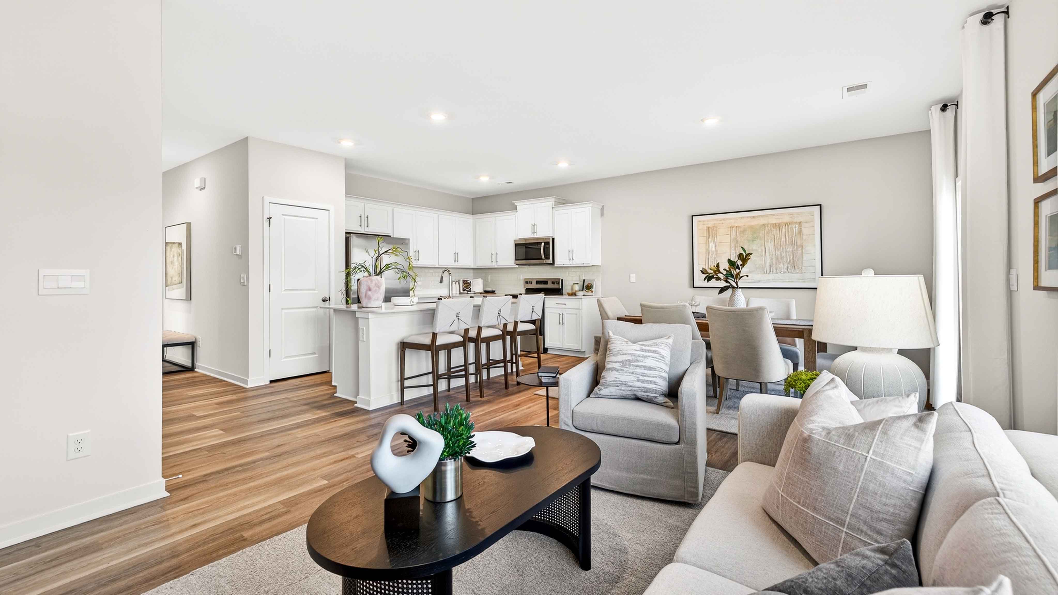 Great room with large window and wood floors