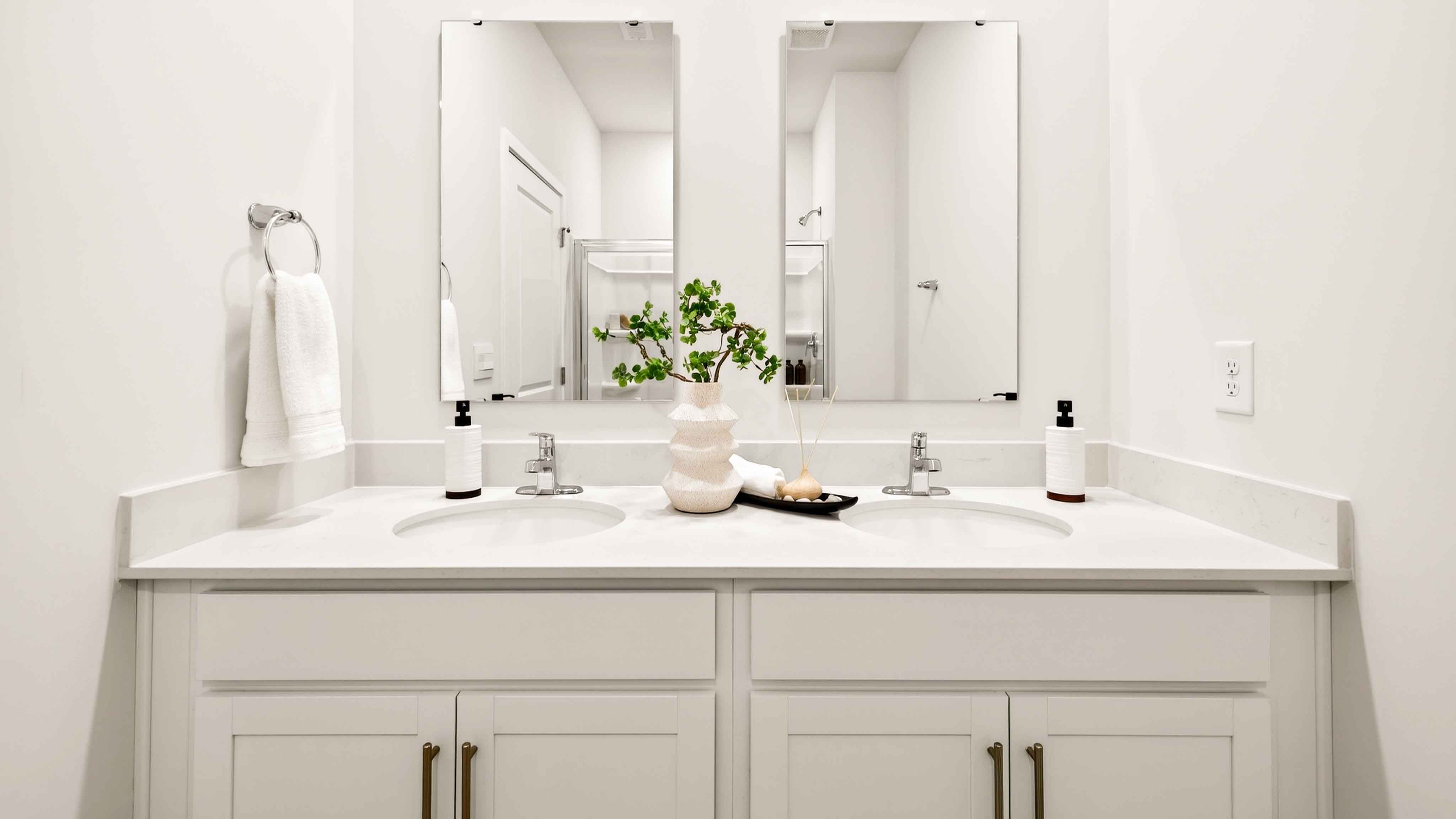 Primary bathroom with white cabinets