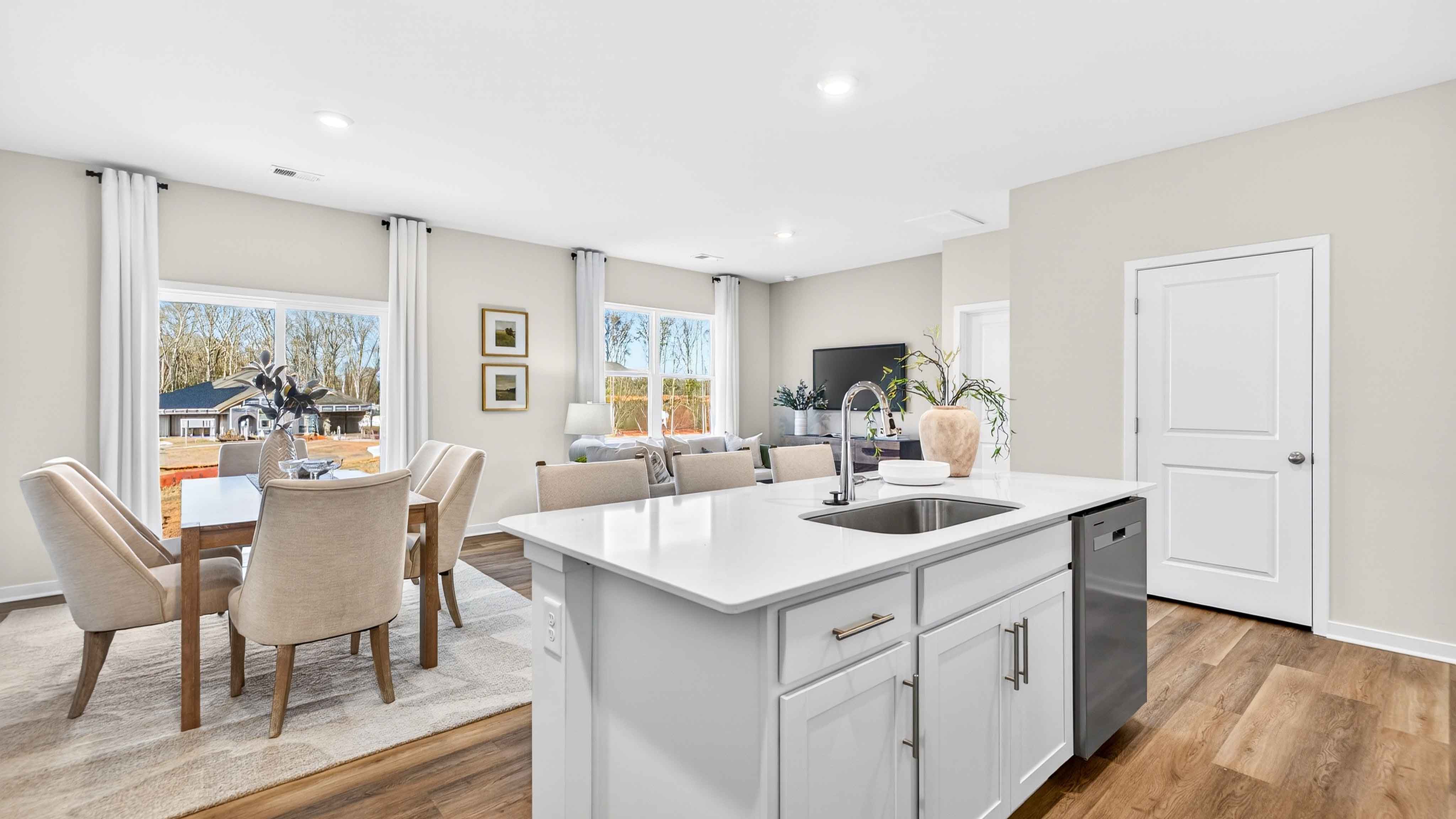 Open kitchen and island with white cabinets
