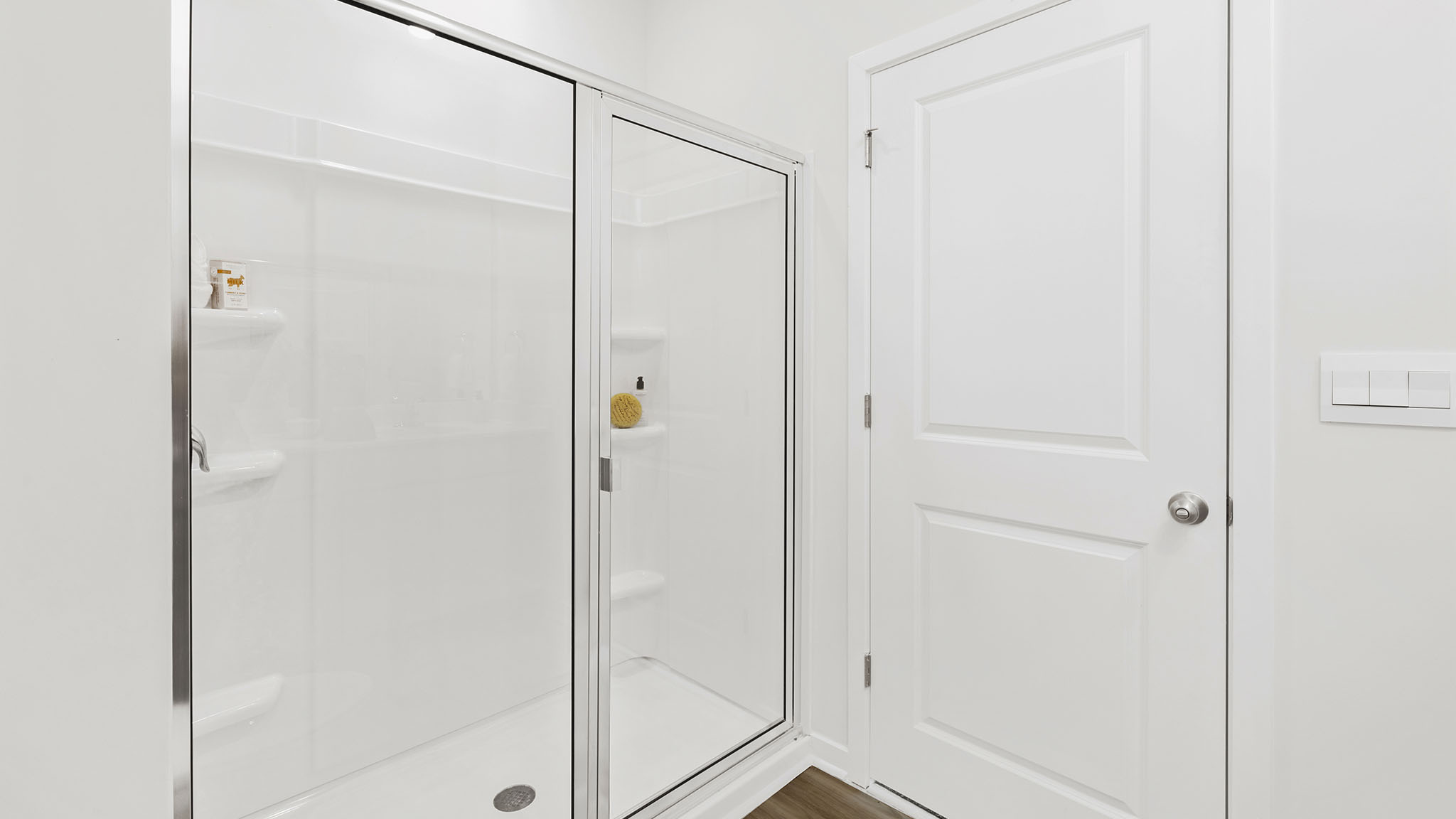 Primary bathroom with white cabinets