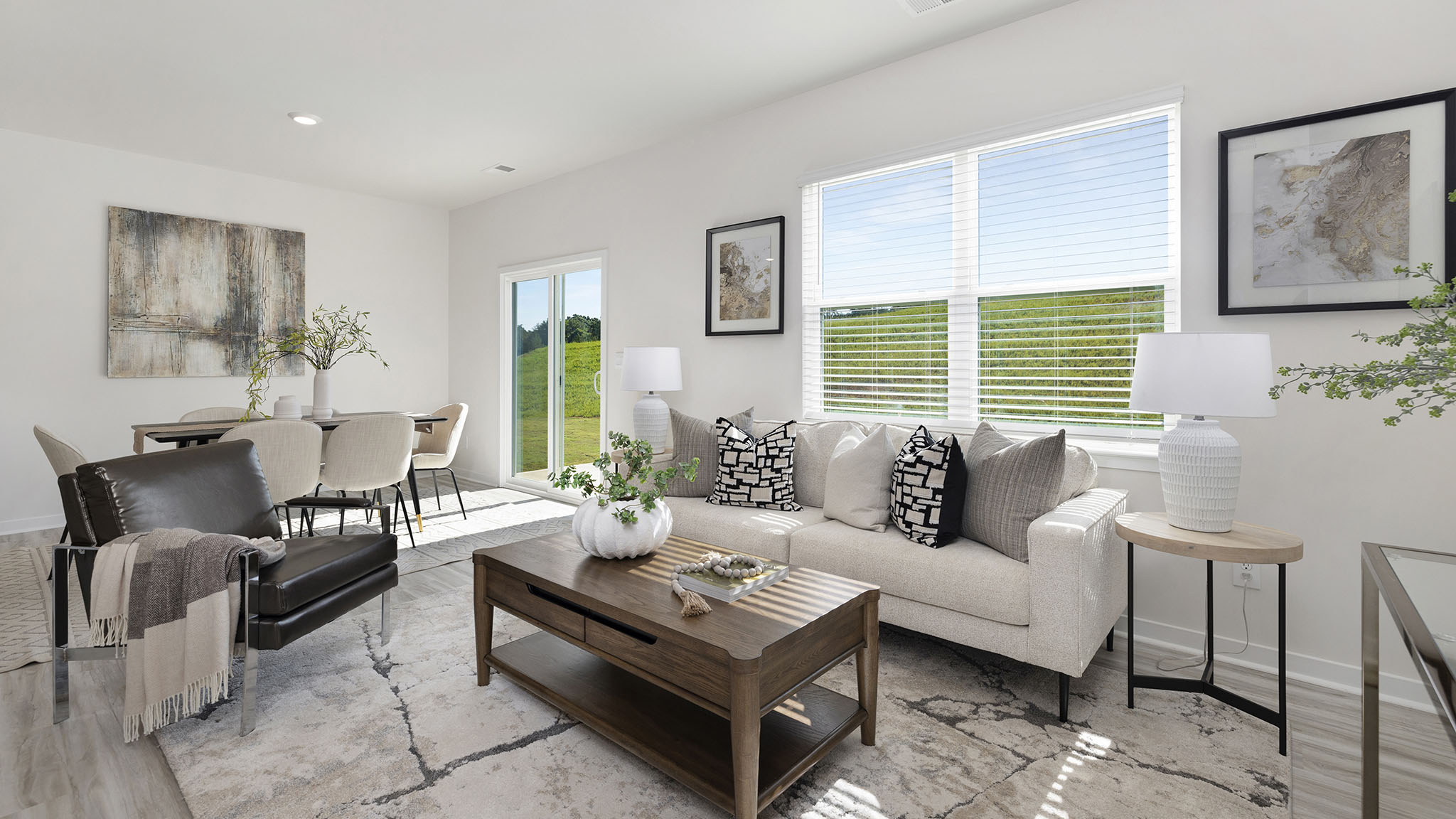 Great room with large window and wood floors