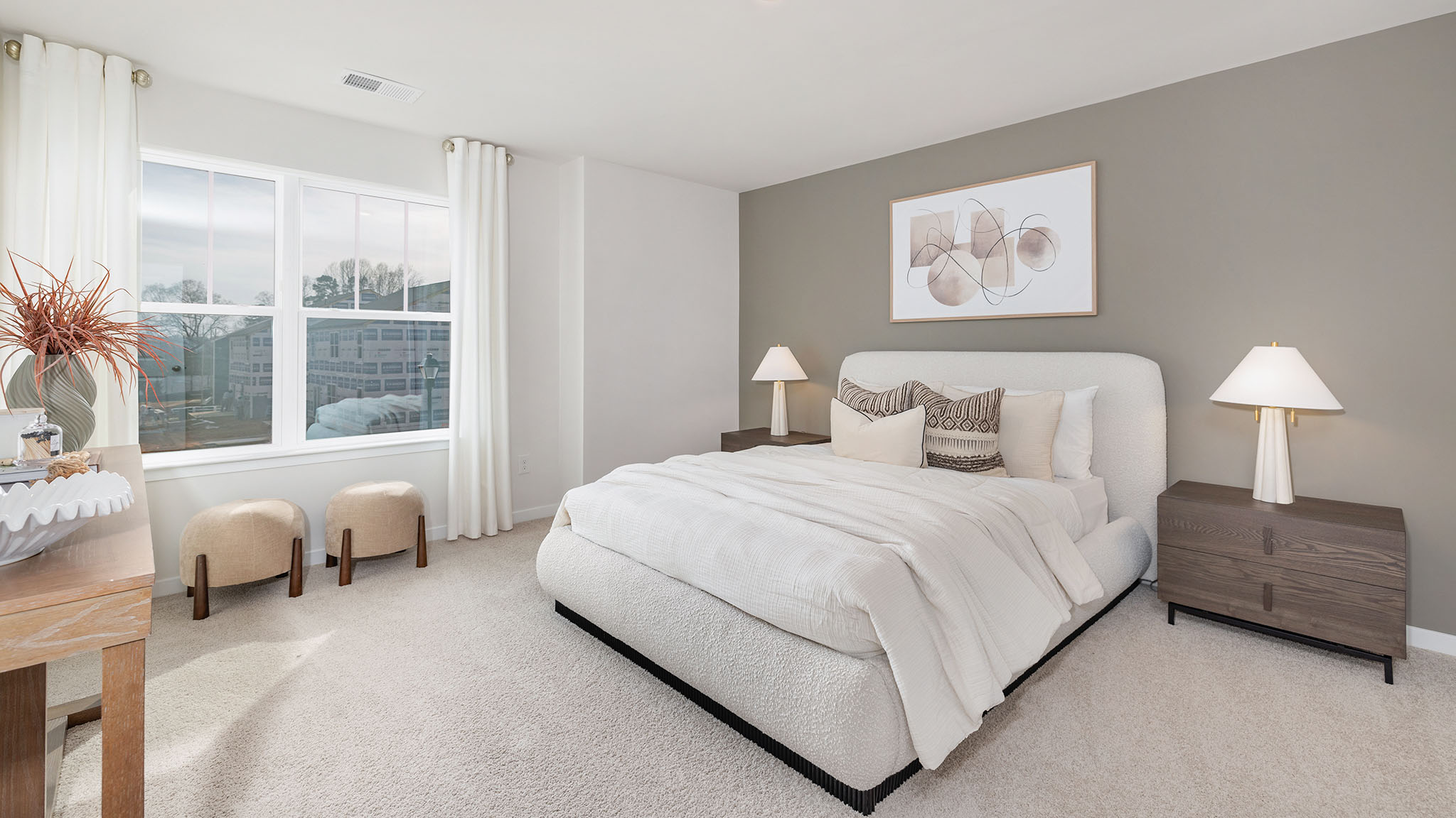 Carpeted bedroom with large window