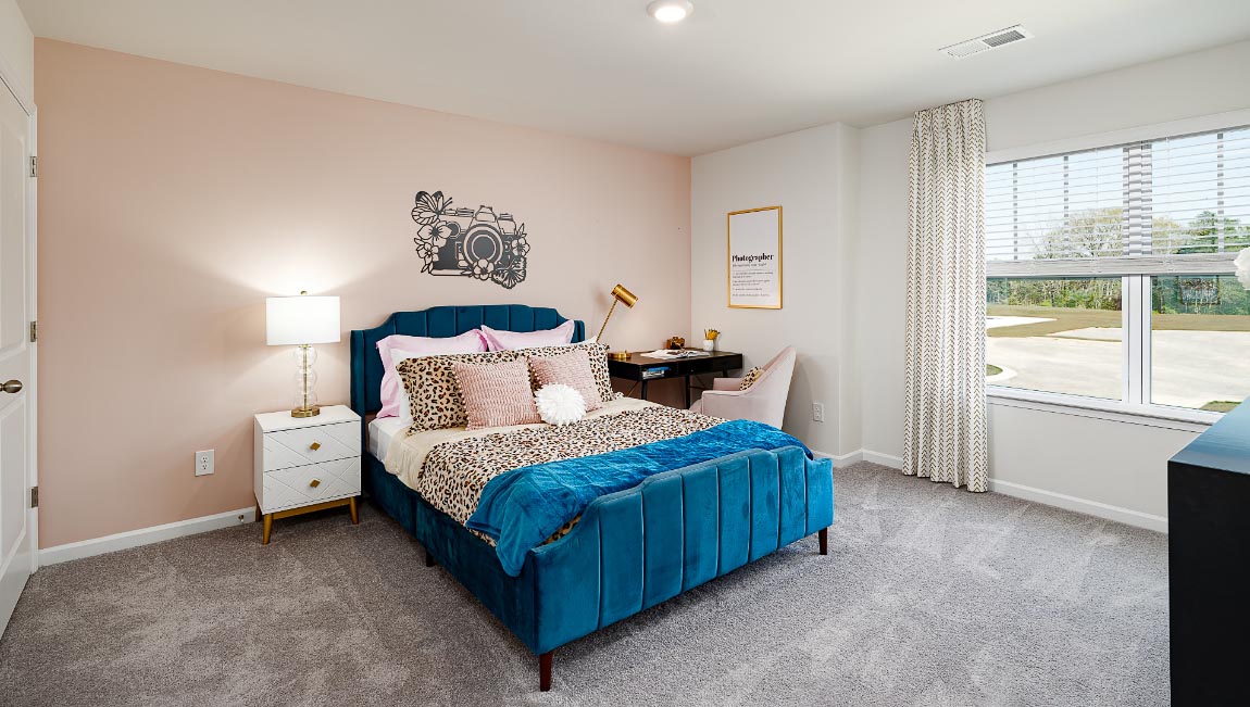 Carpeted bedroom with large window