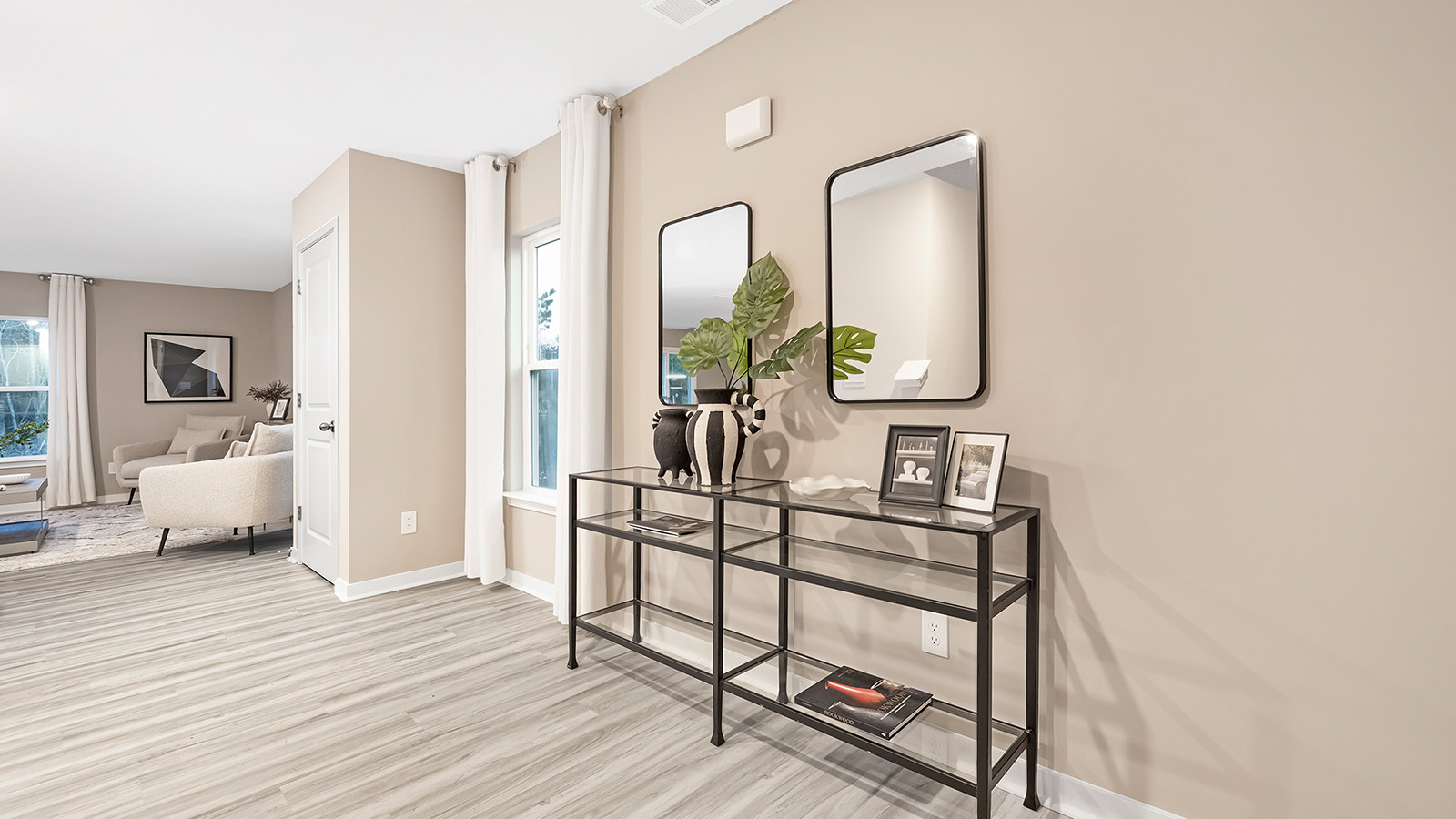 Welcoming foyer with view of front door and stairs