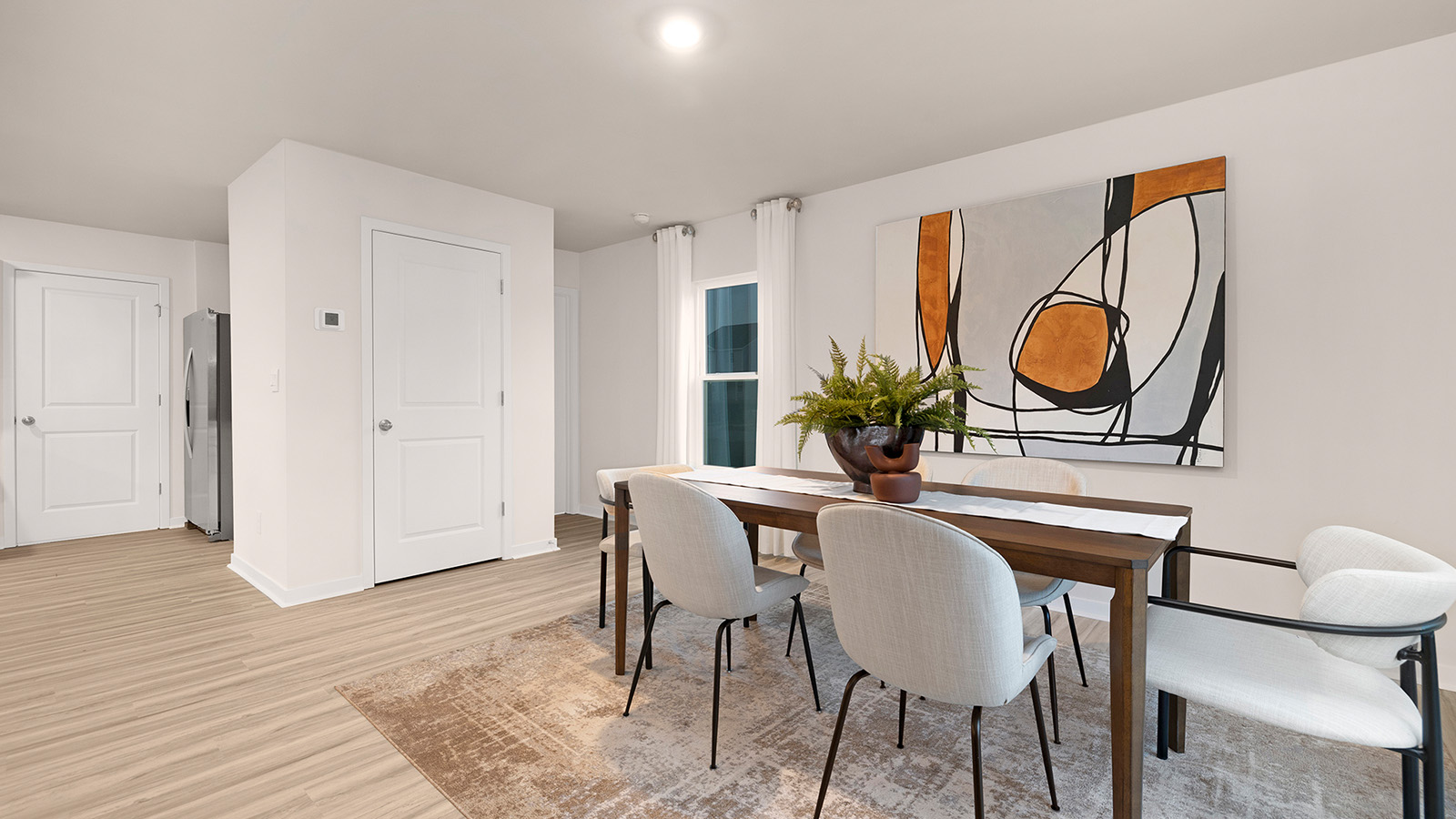 Dining area with wood floor and sliding glass door