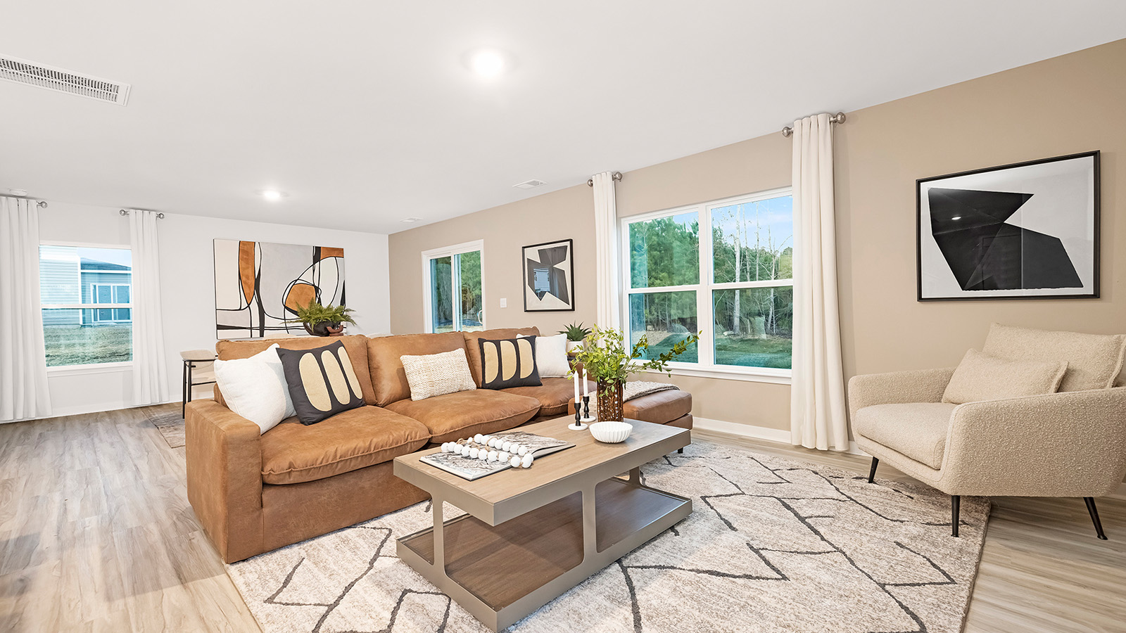 Spacious family room with windows and fireplace